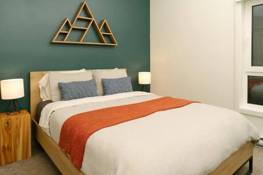 Bed in The Nest - Condo with Hot Tub & BBQ