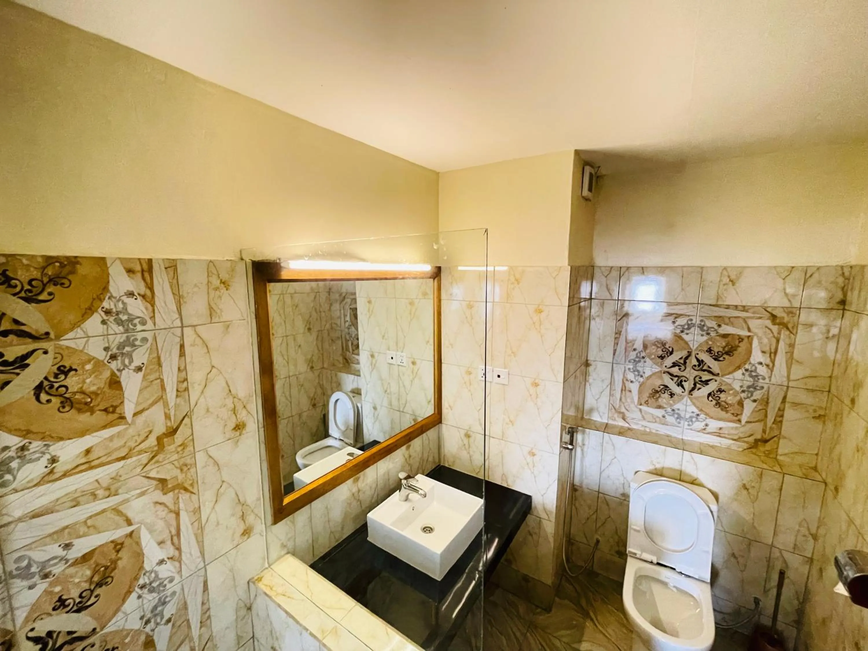 Bathroom in Pulickal Heights Hotel