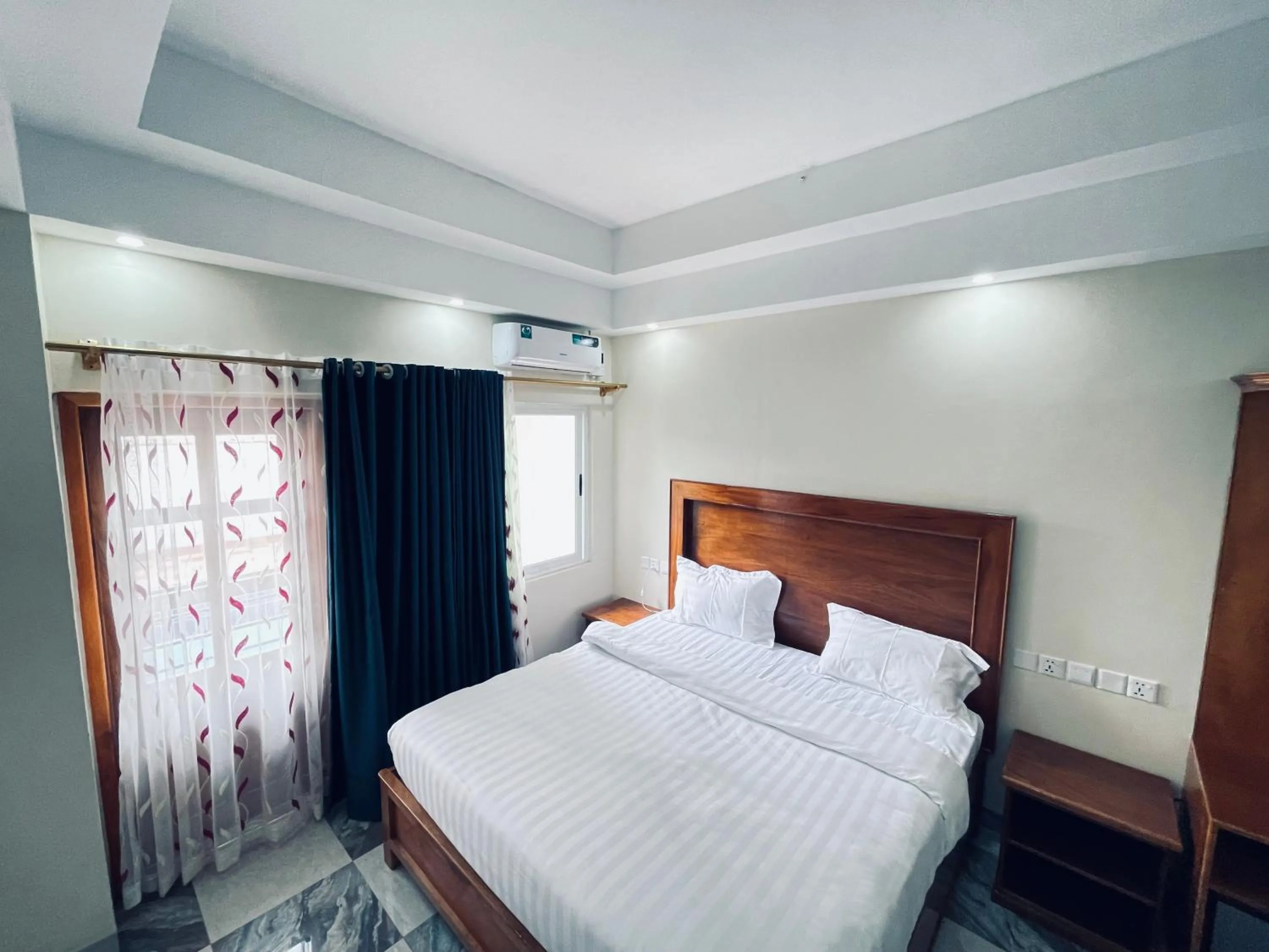 Bed in Pulickal Heights Hotel