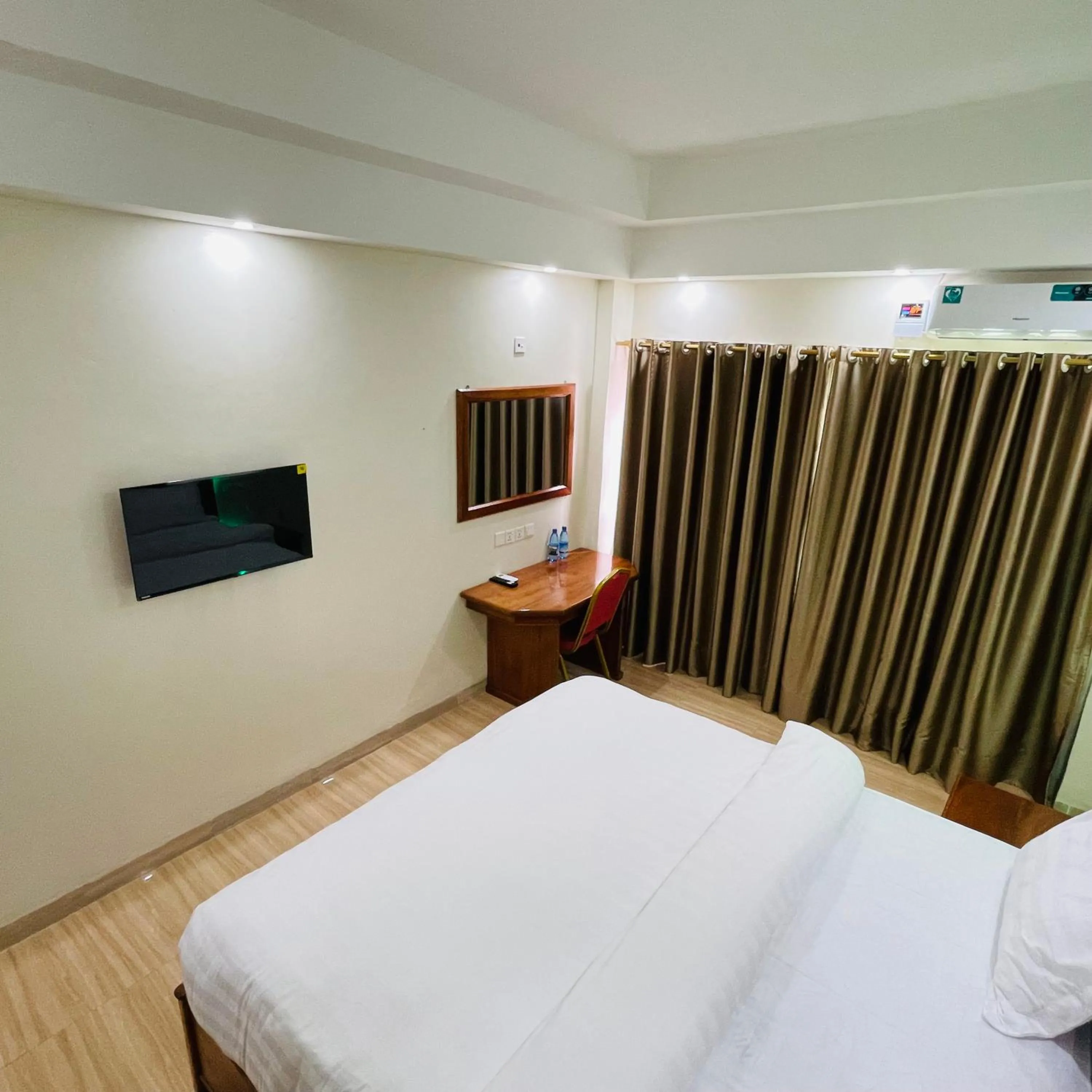 Bed in Pulickal Heights Hotel
