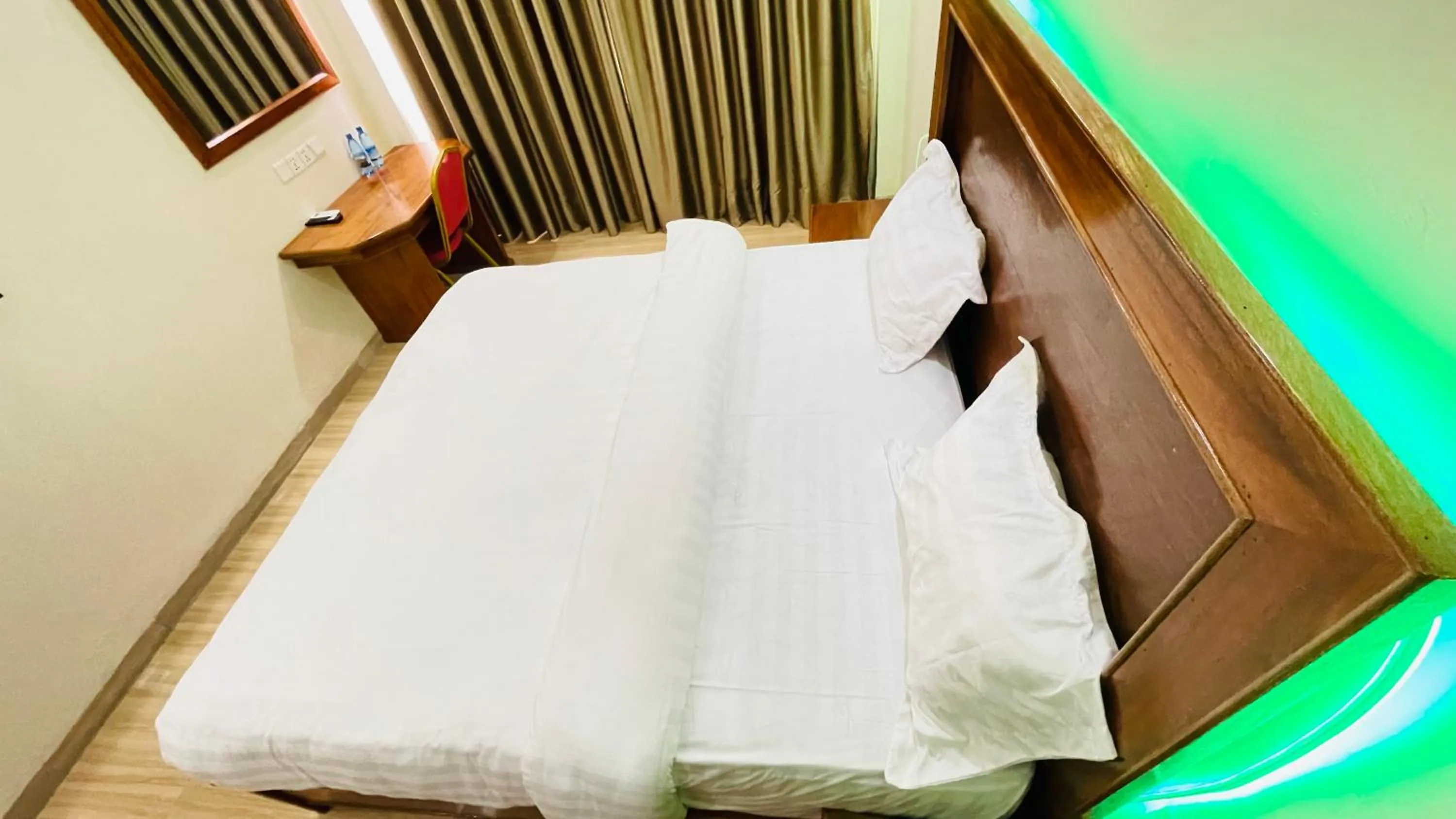 Bed in Pulickal Heights Hotel