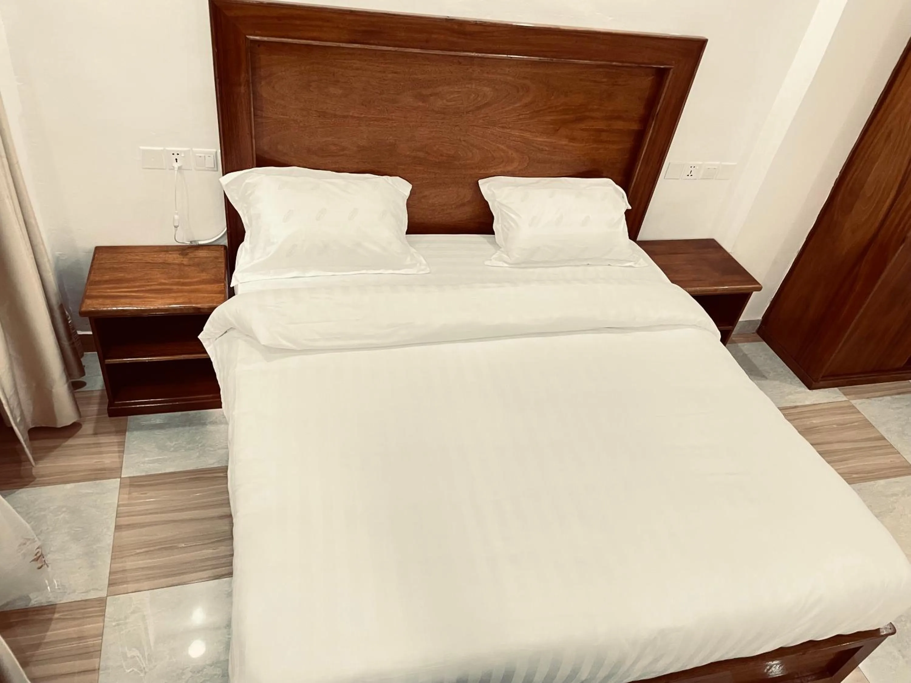 Bed in Pulickal Heights Hotel