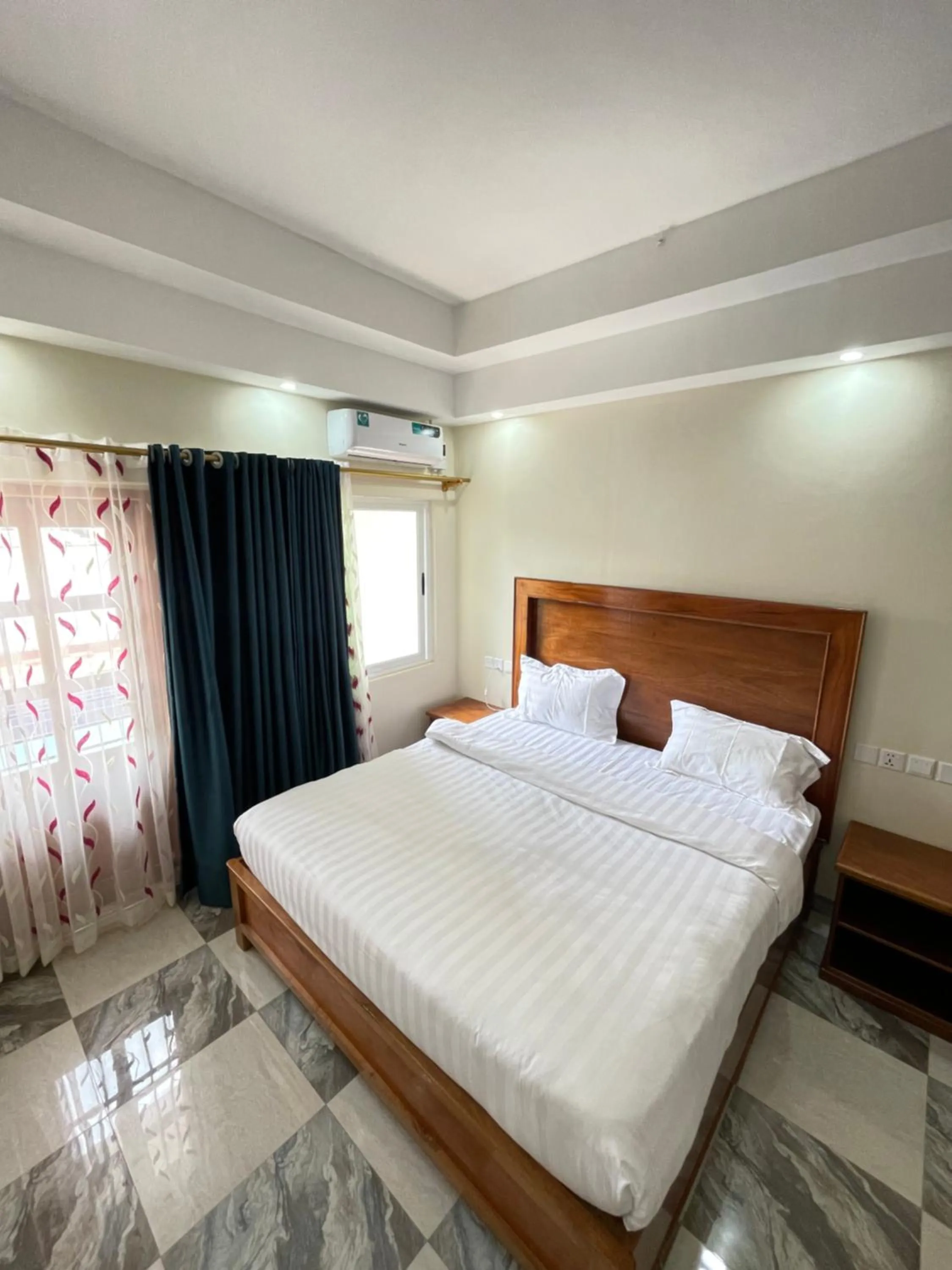 Bed in Pulickal Heights Hotel