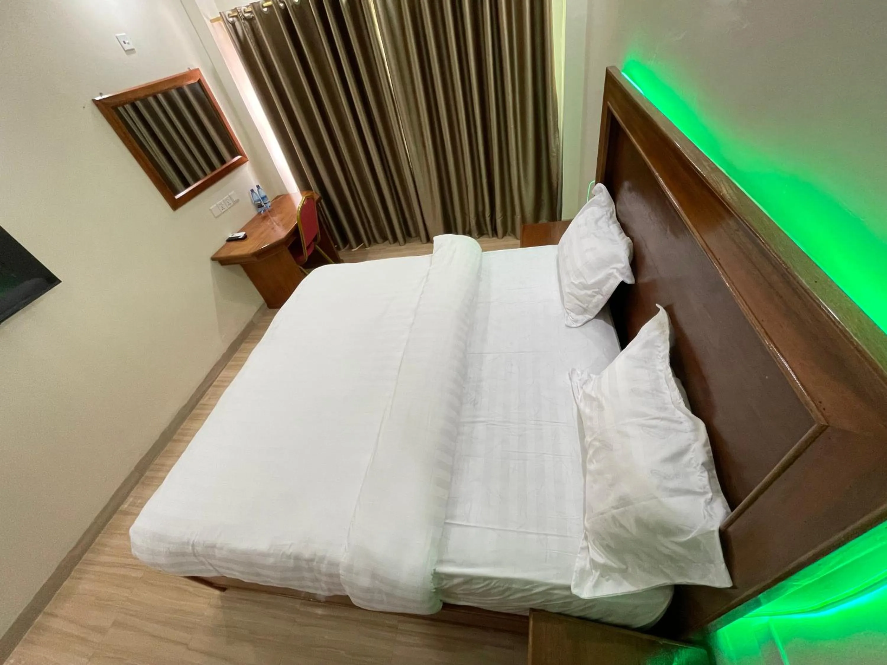 Bed in Pulickal Heights Hotel