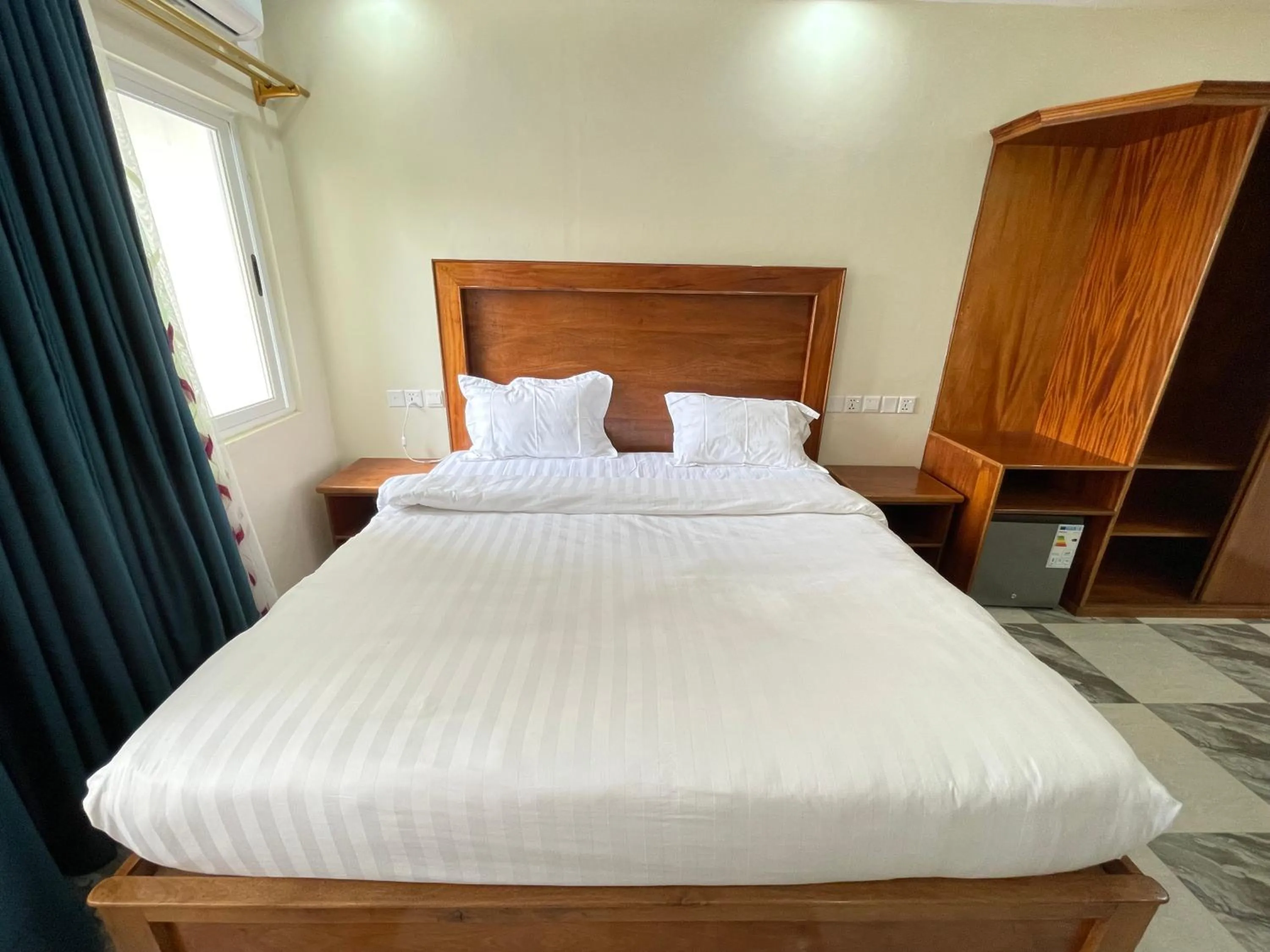Bed in Pulickal Heights Hotel