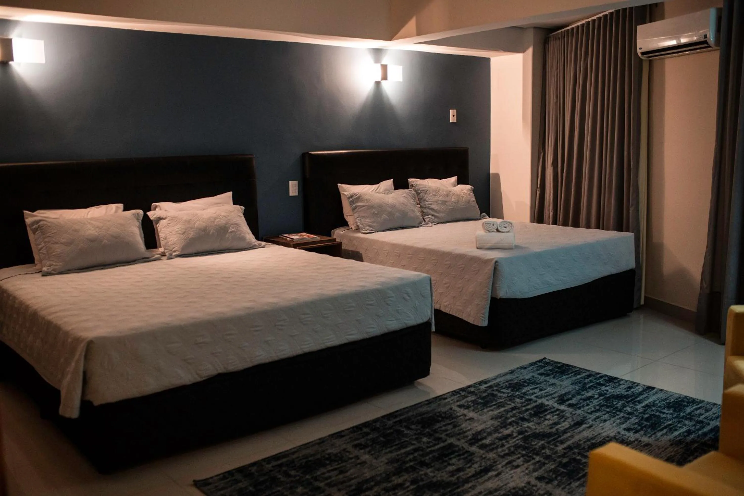 Bed in Ipe Center Hotel