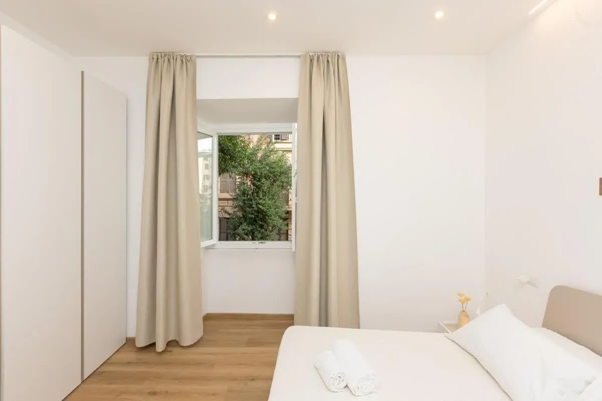 Photo of the whole room, Bed in Colosseum Holidays - Three-Bedroom Apartment