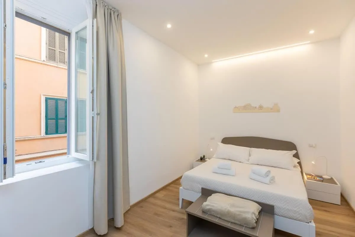 Bed in Colosseum Holidays - Three-Bedroom Apartment