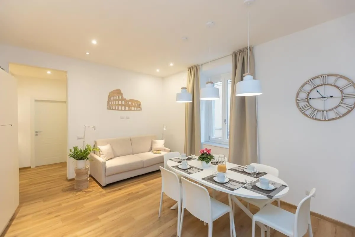Living room, Bed in Colosseum Holidays - Three-Bedroom Apartment
