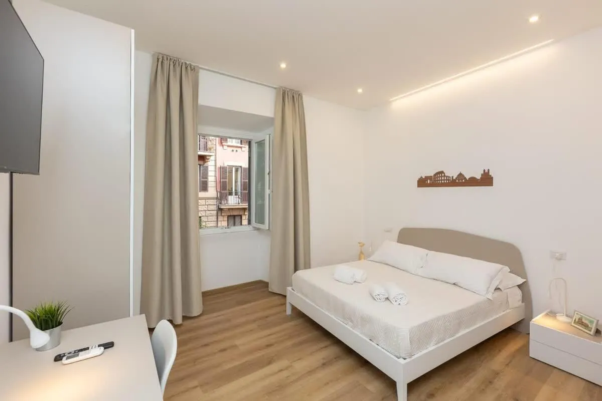 Bed in Colosseum Holidays - Three-Bedroom Apartment