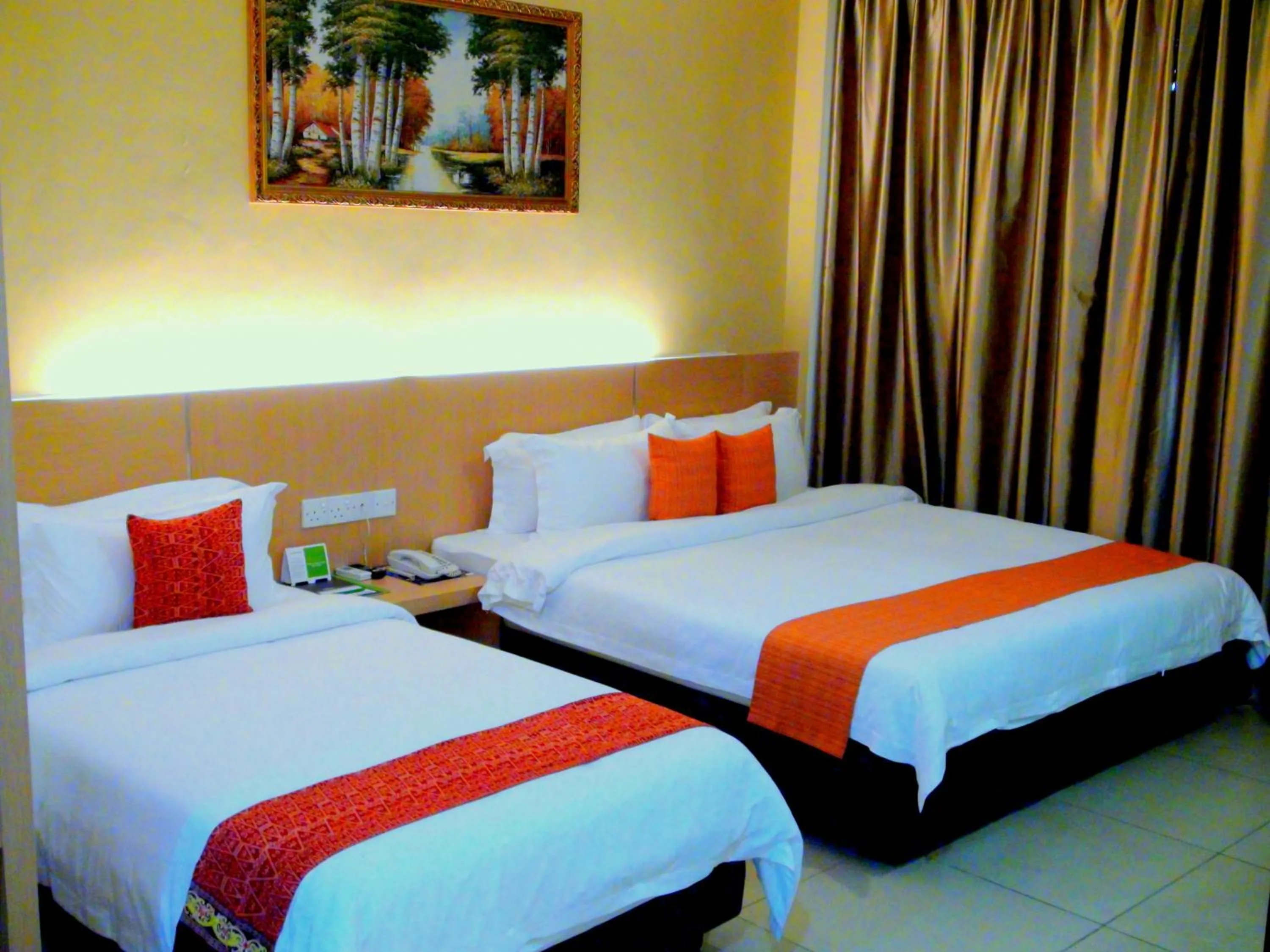 Bed in Paragon Lutong Hotel