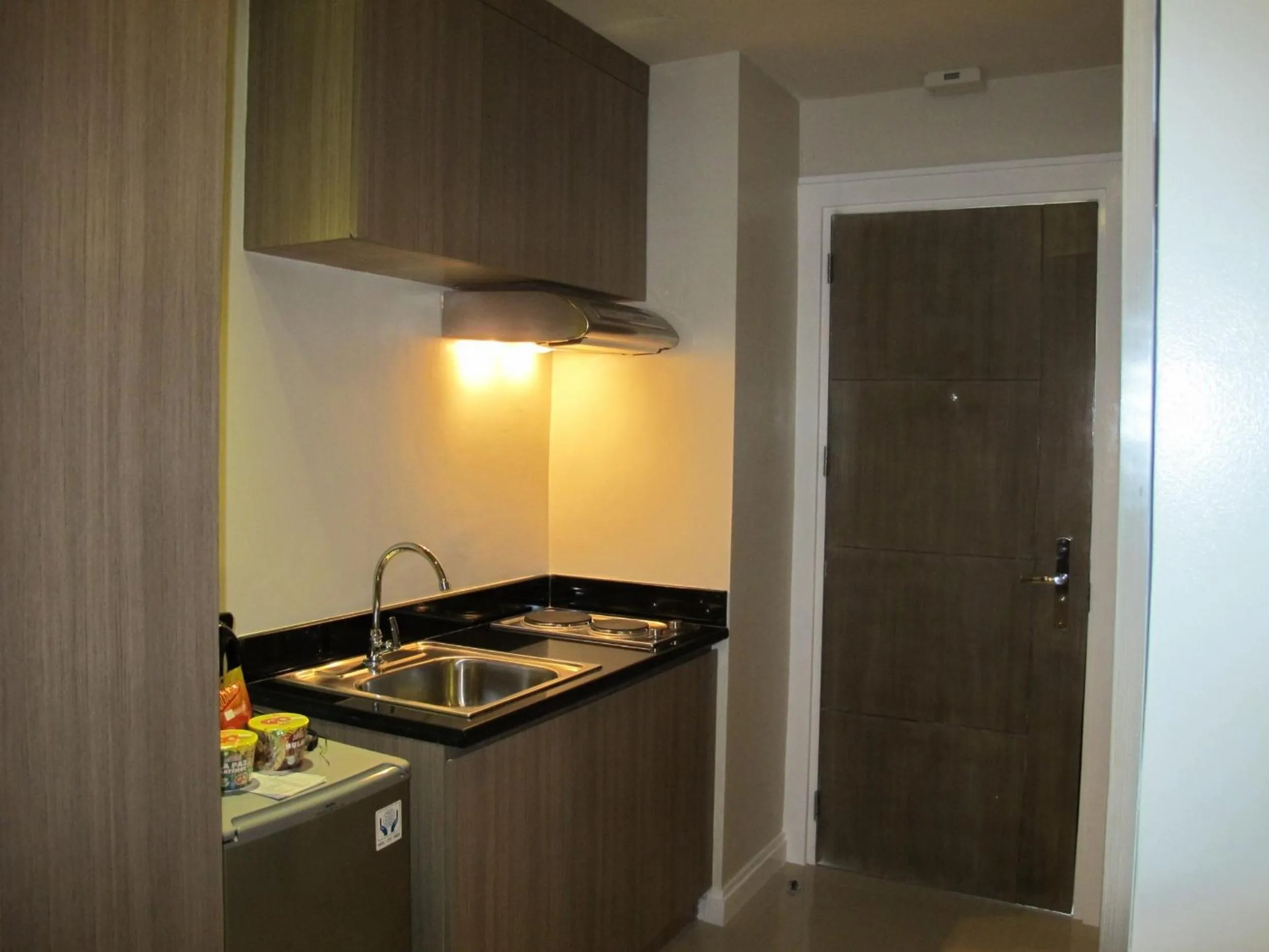 Kitchen or kitchenette in Zerenity Hotel & Suites