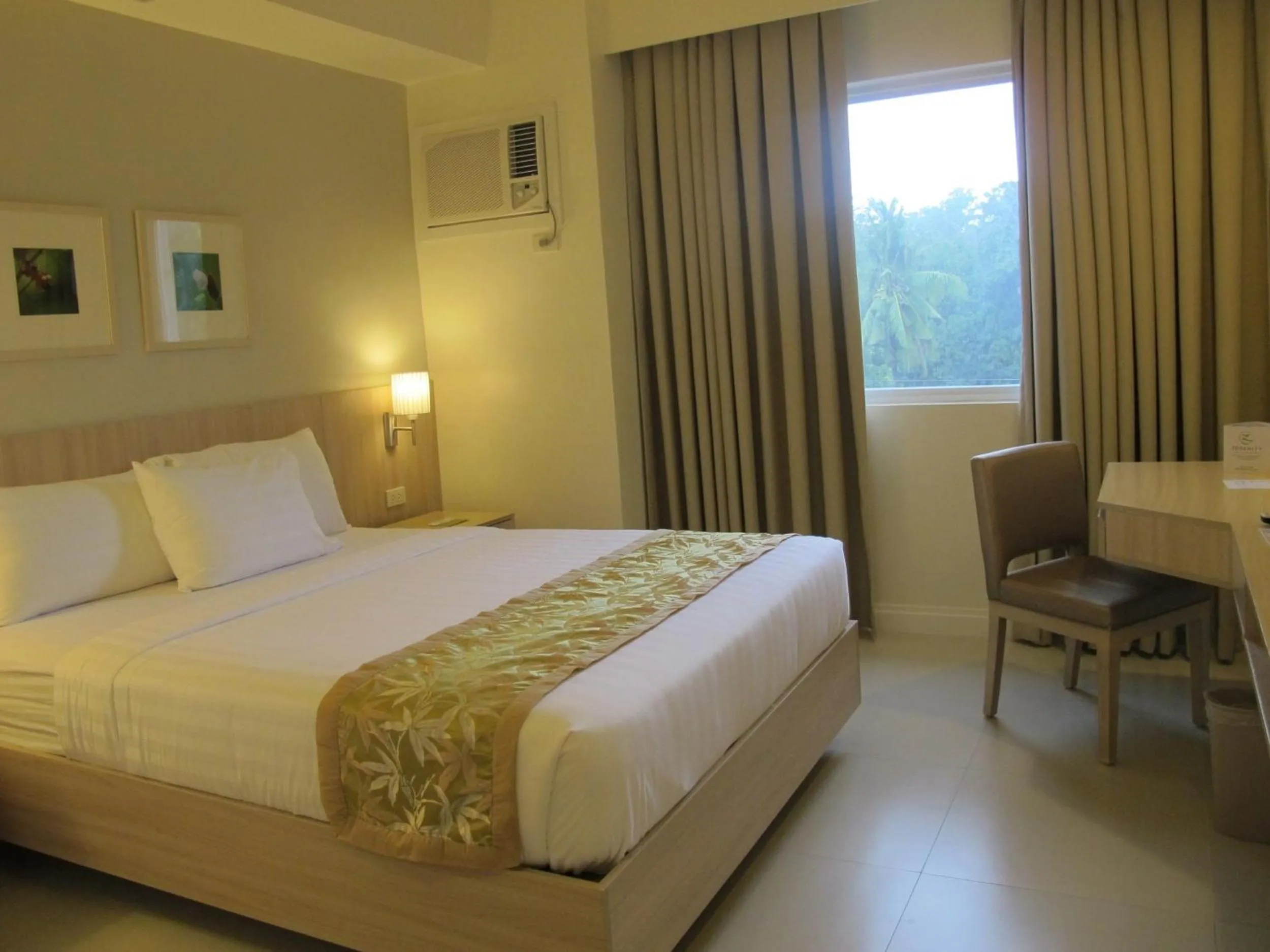 Photo of the whole room, Bed in Zerenity Hotel & Suites