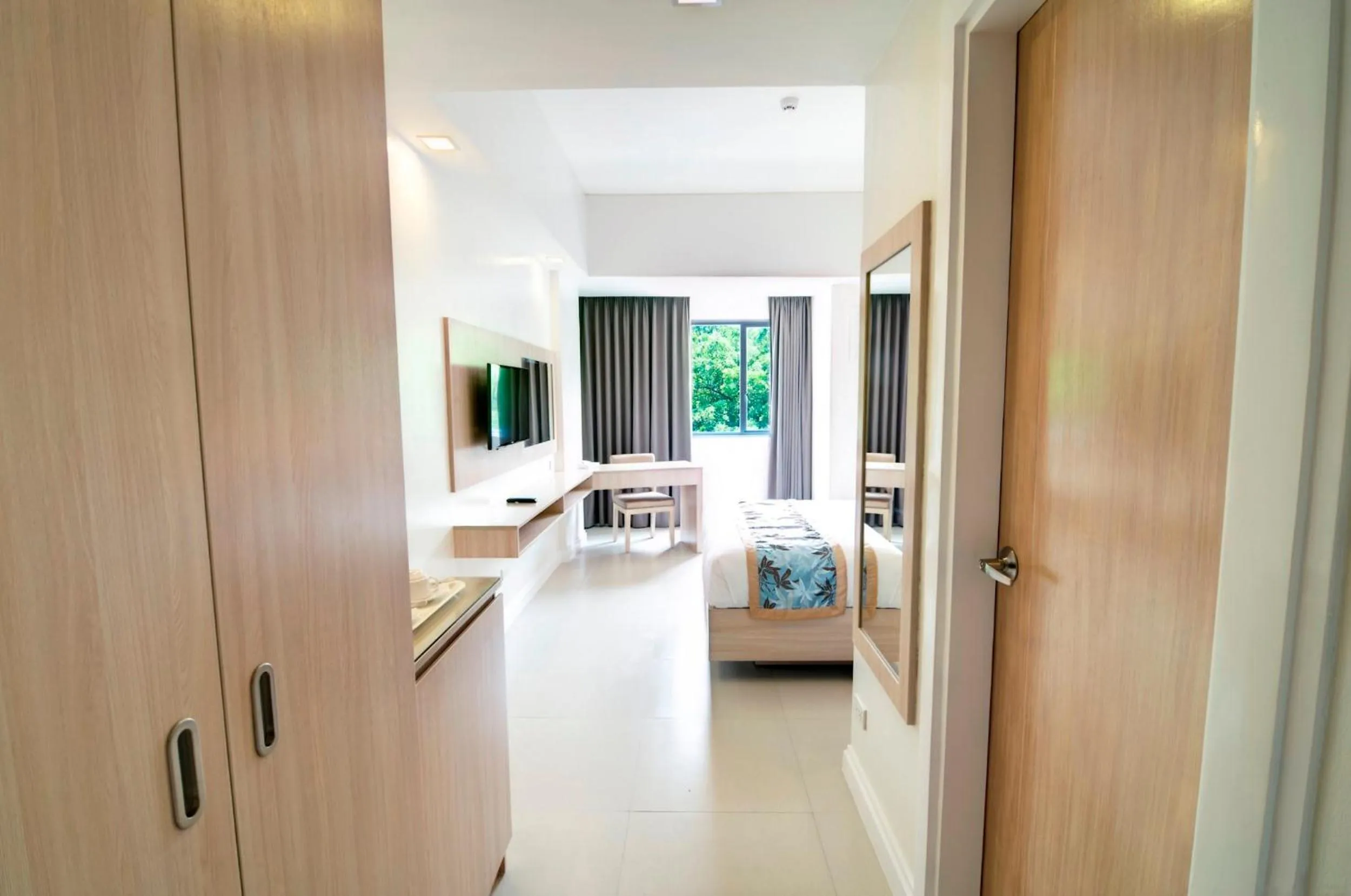 Photo of the whole room, Bed in Zerenity Hotel & Suites