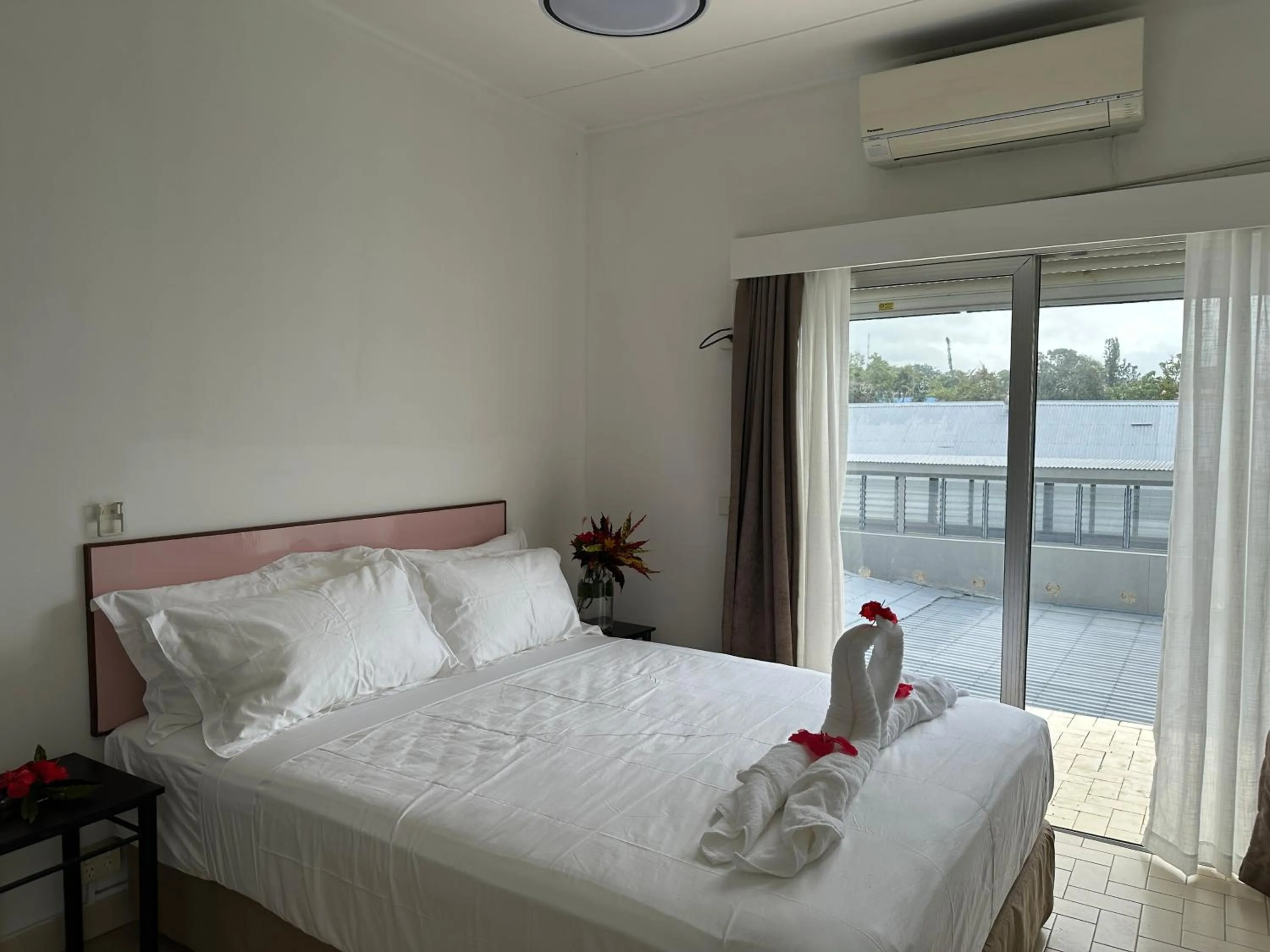 Bed in Coconut Palms Resort & Diamond Casino