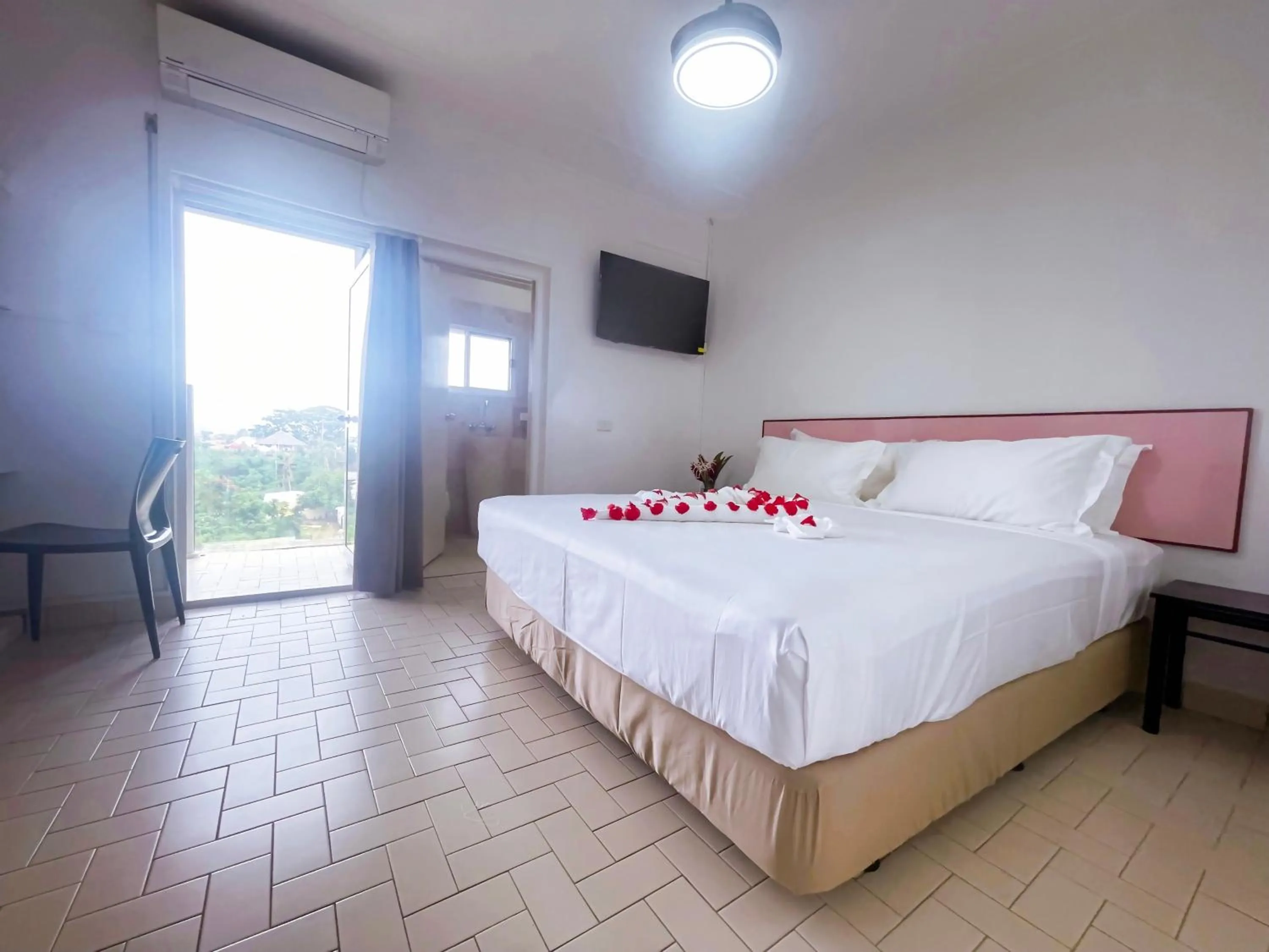 Bed in Coconut Palms Resort & Diamond Casino