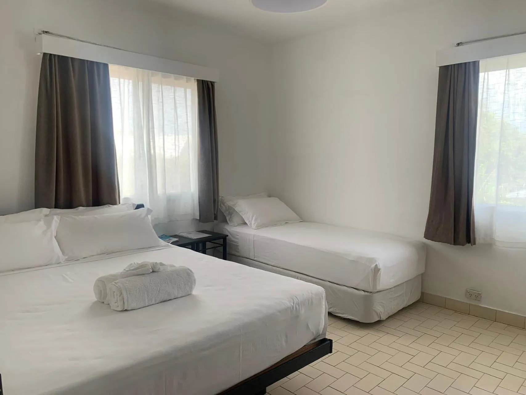 Bed in Coconut Palms Resort & Diamond Casino