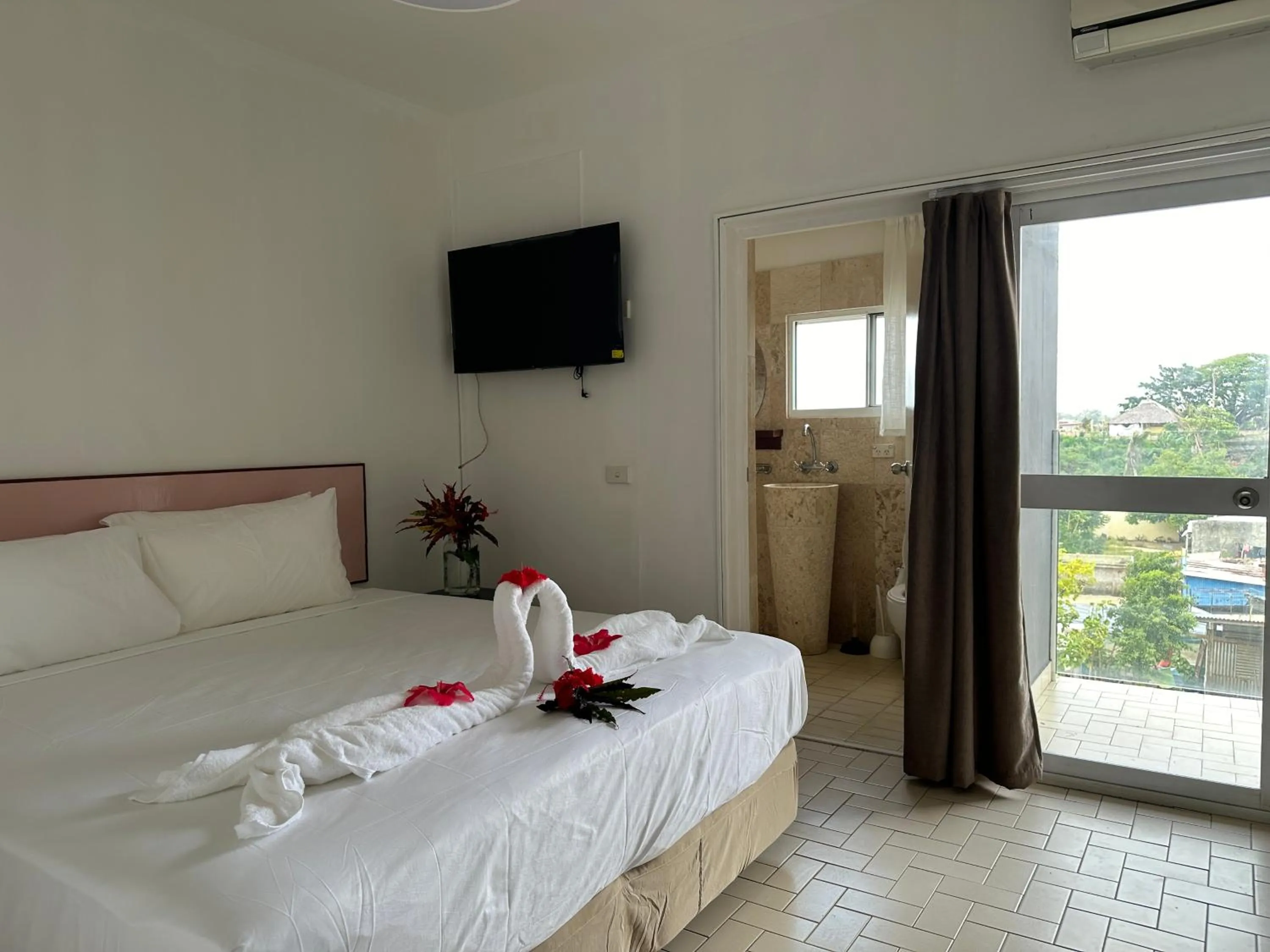 Bed in Coconut Palms Resort & Diamond Casino