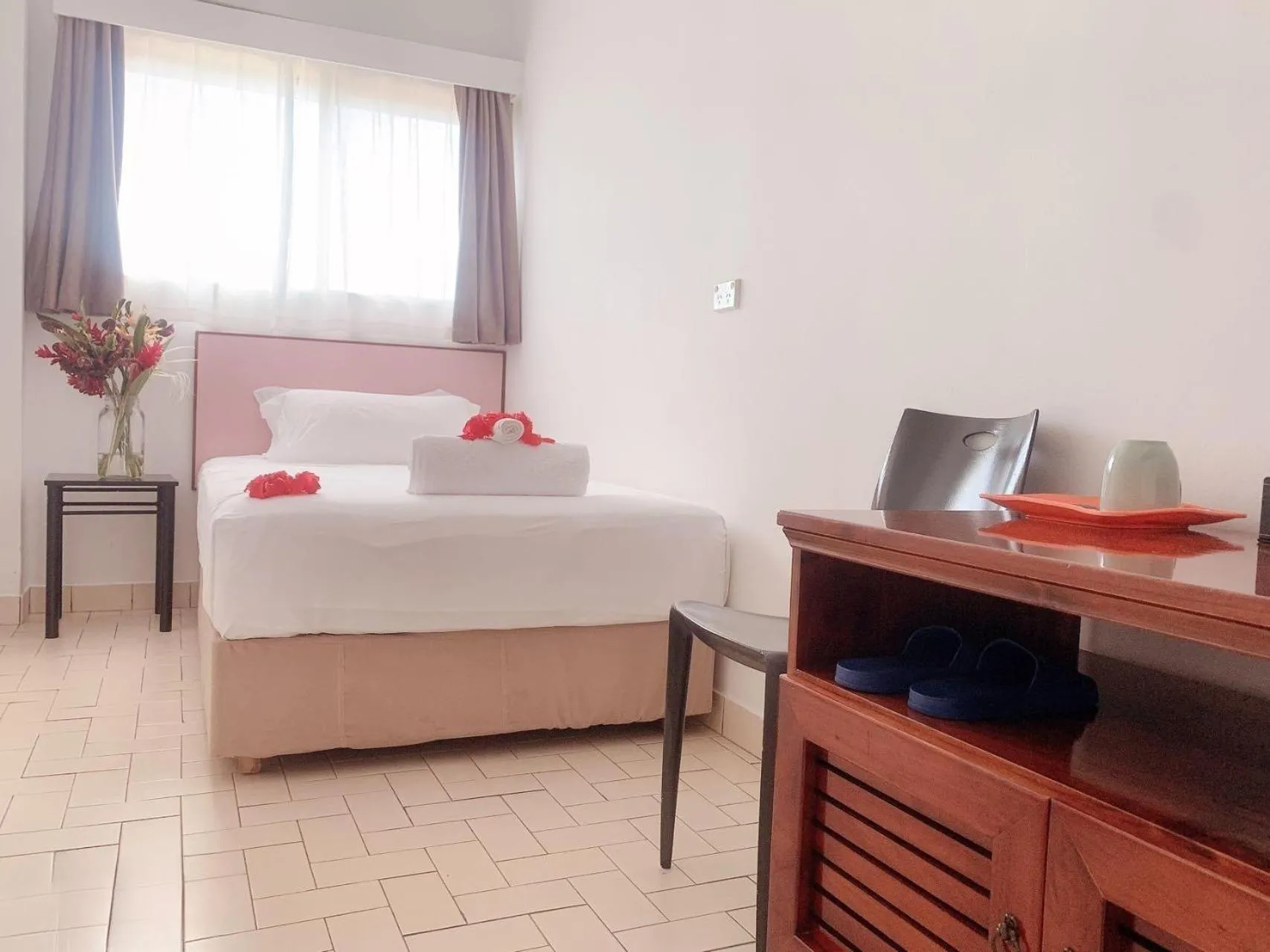 Bed in Coconut Palms Resort & Diamond Casino