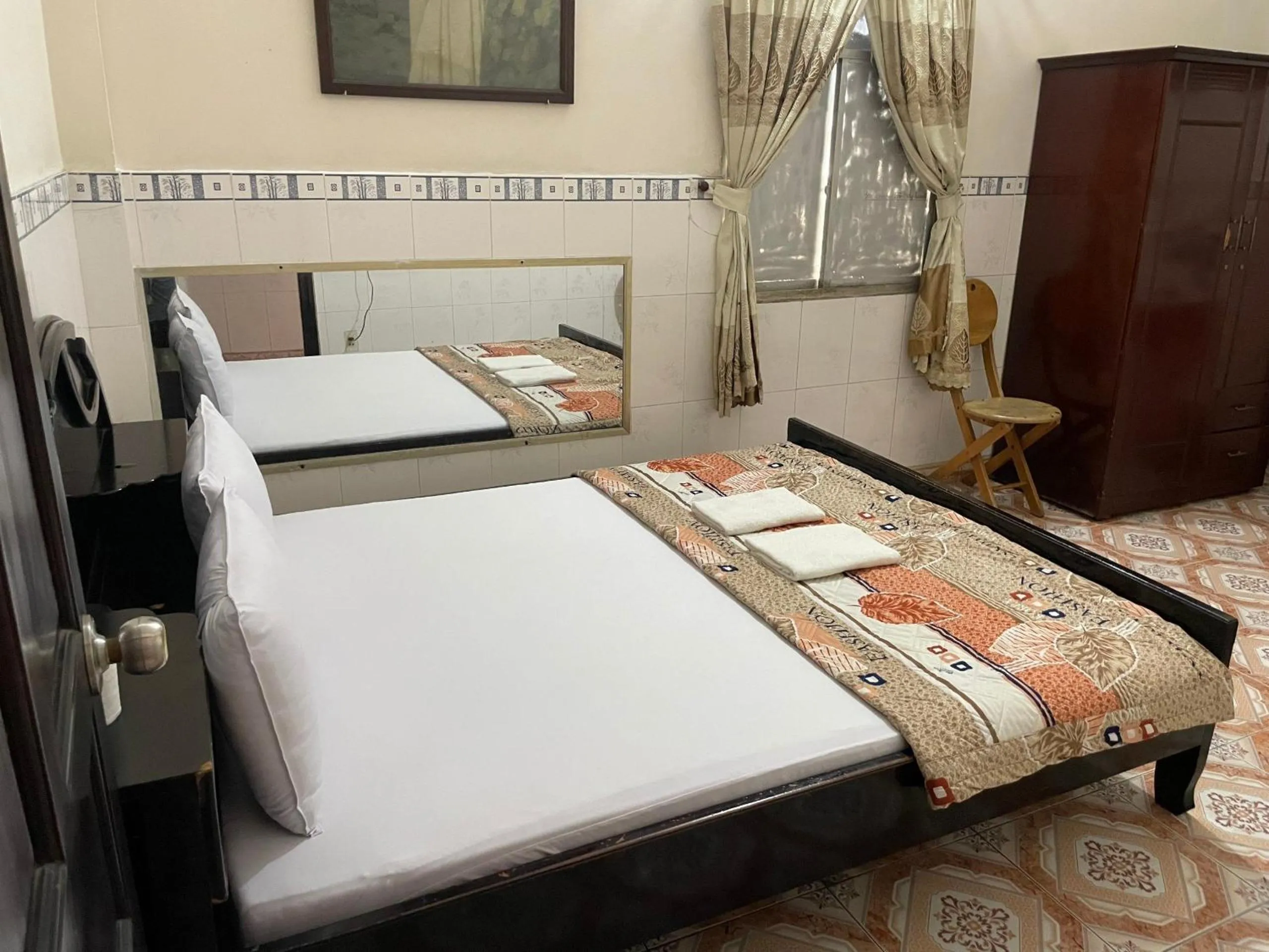 Bed in QUỲNH HOA HOTEL