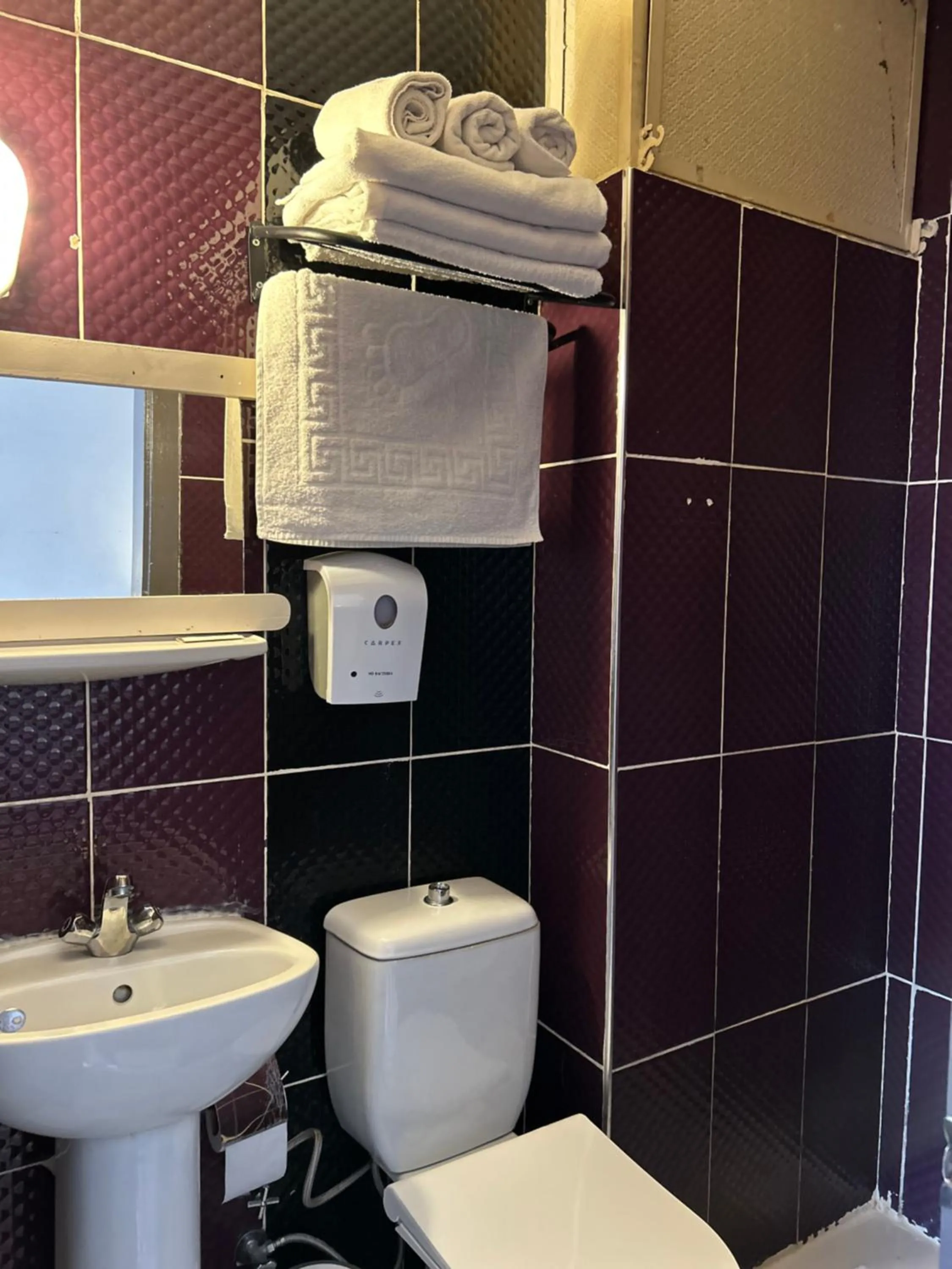 Toilet in Cord Hotel & Resort