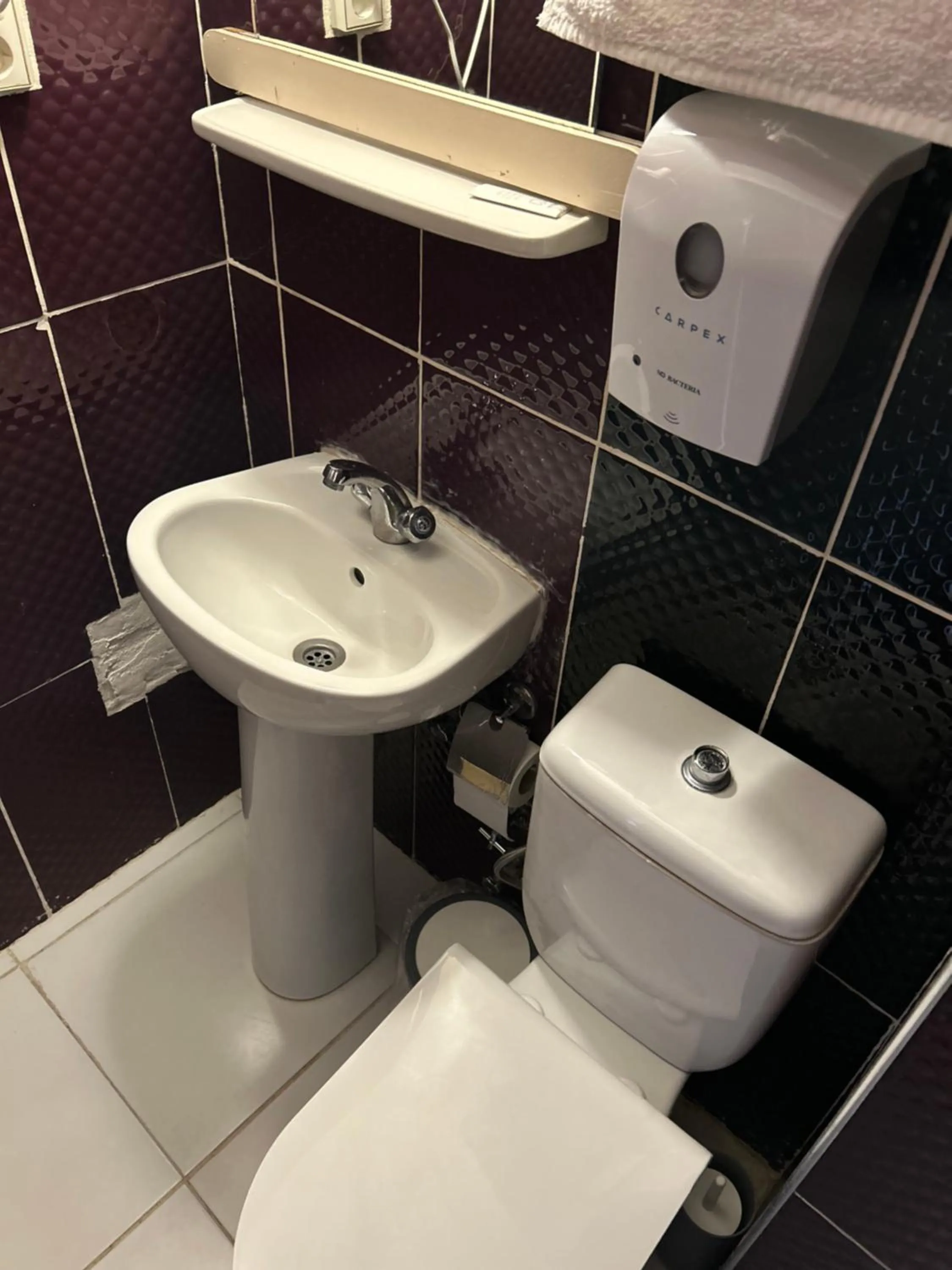 Toilet in Cord Hotel & Resort