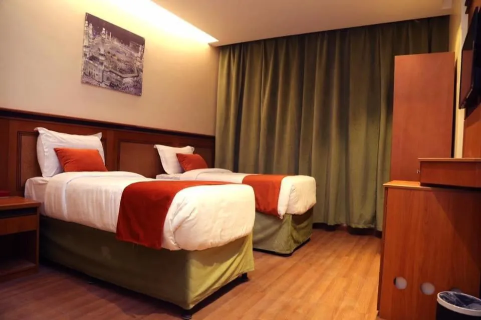 Bed in Al Bostan Al Masi Hotel