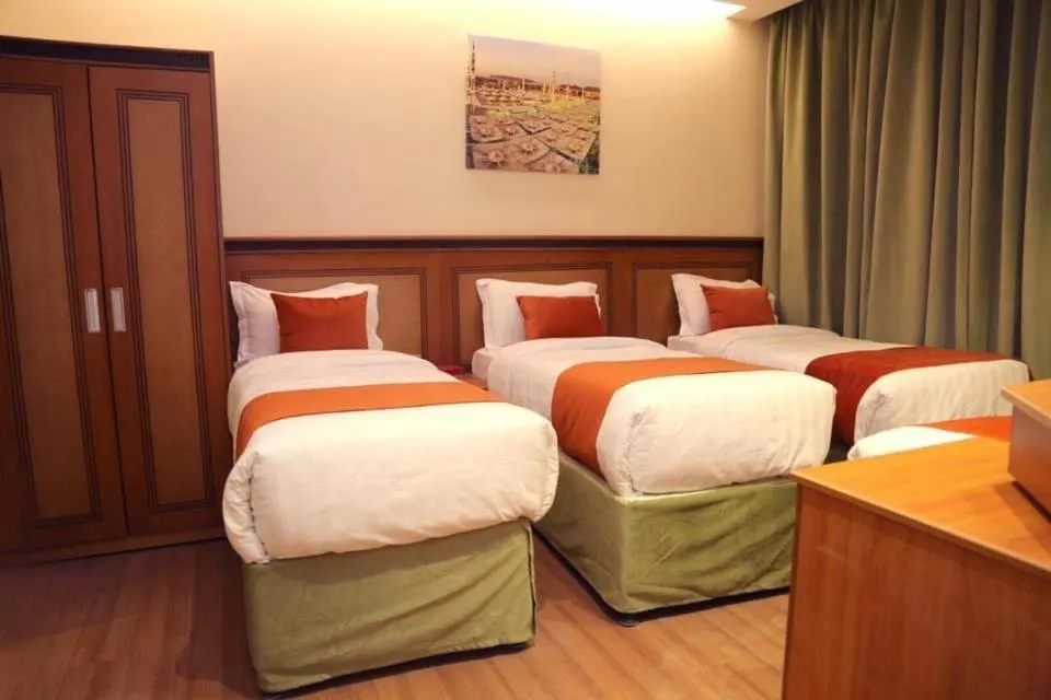 Bed in Al Bostan Al Masi Hotel