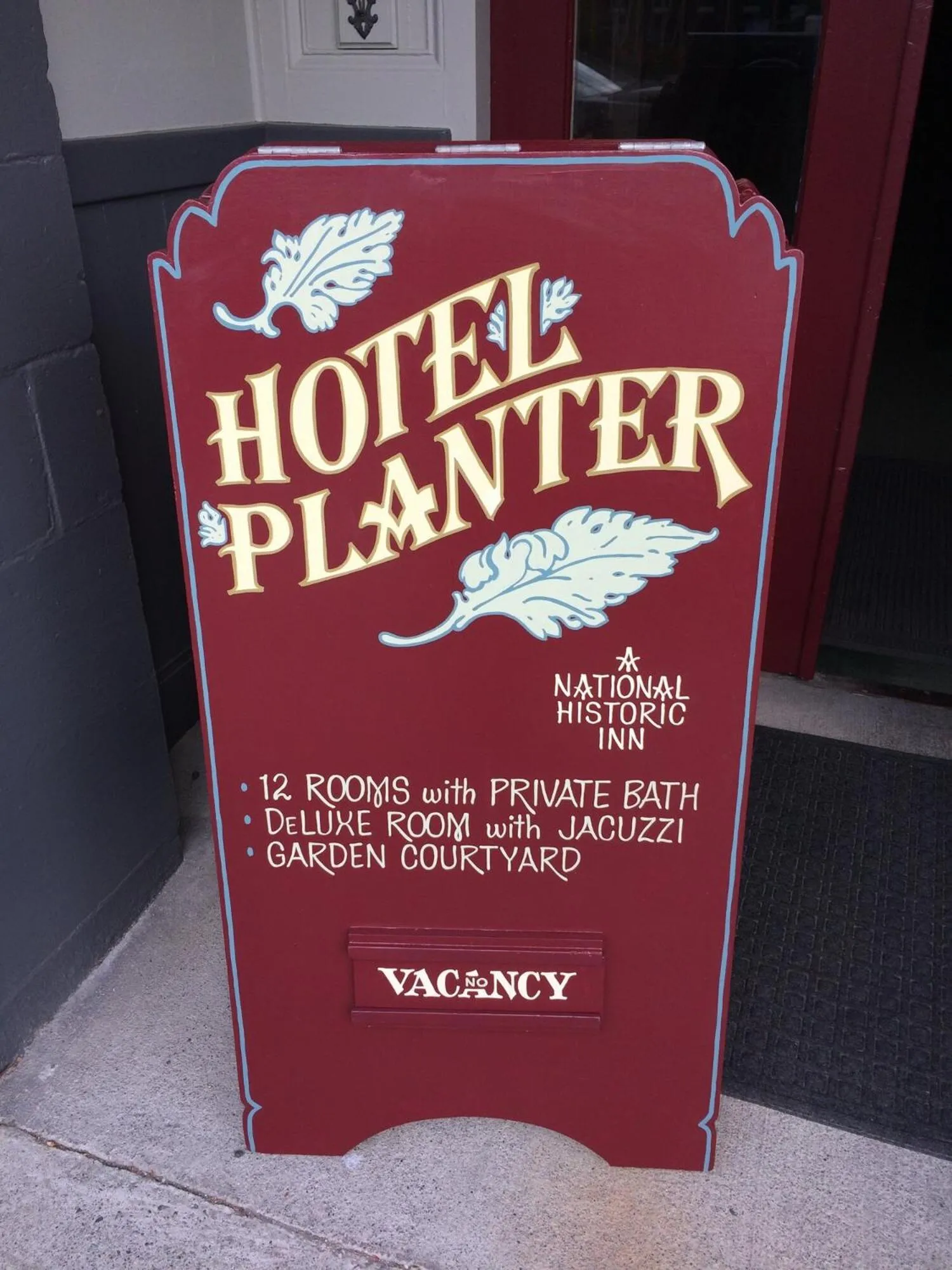 Property logo or sign in Hotel Planter