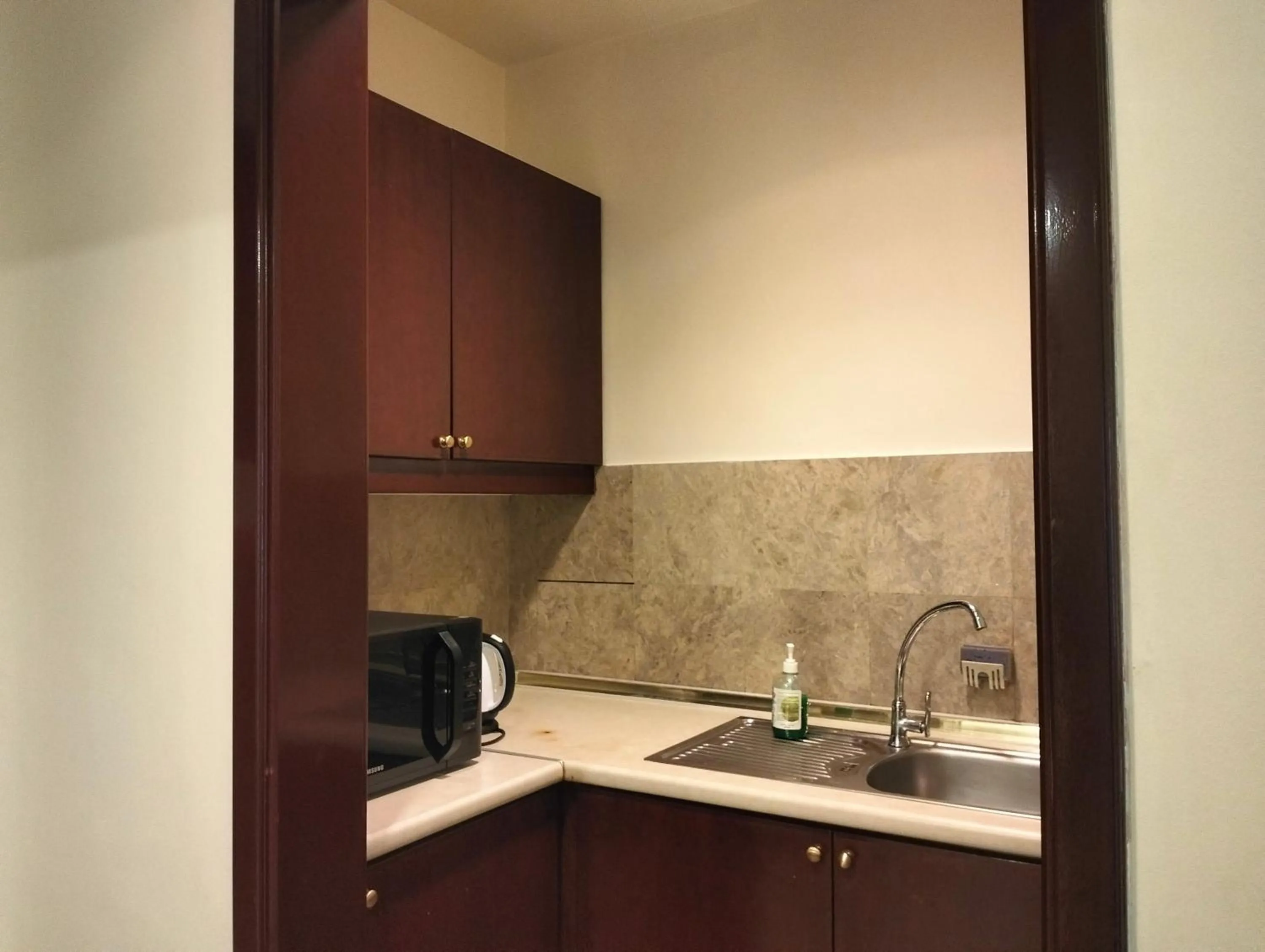 Kitchen or kitchenette in Luxy Service Apartment at Times Square KL