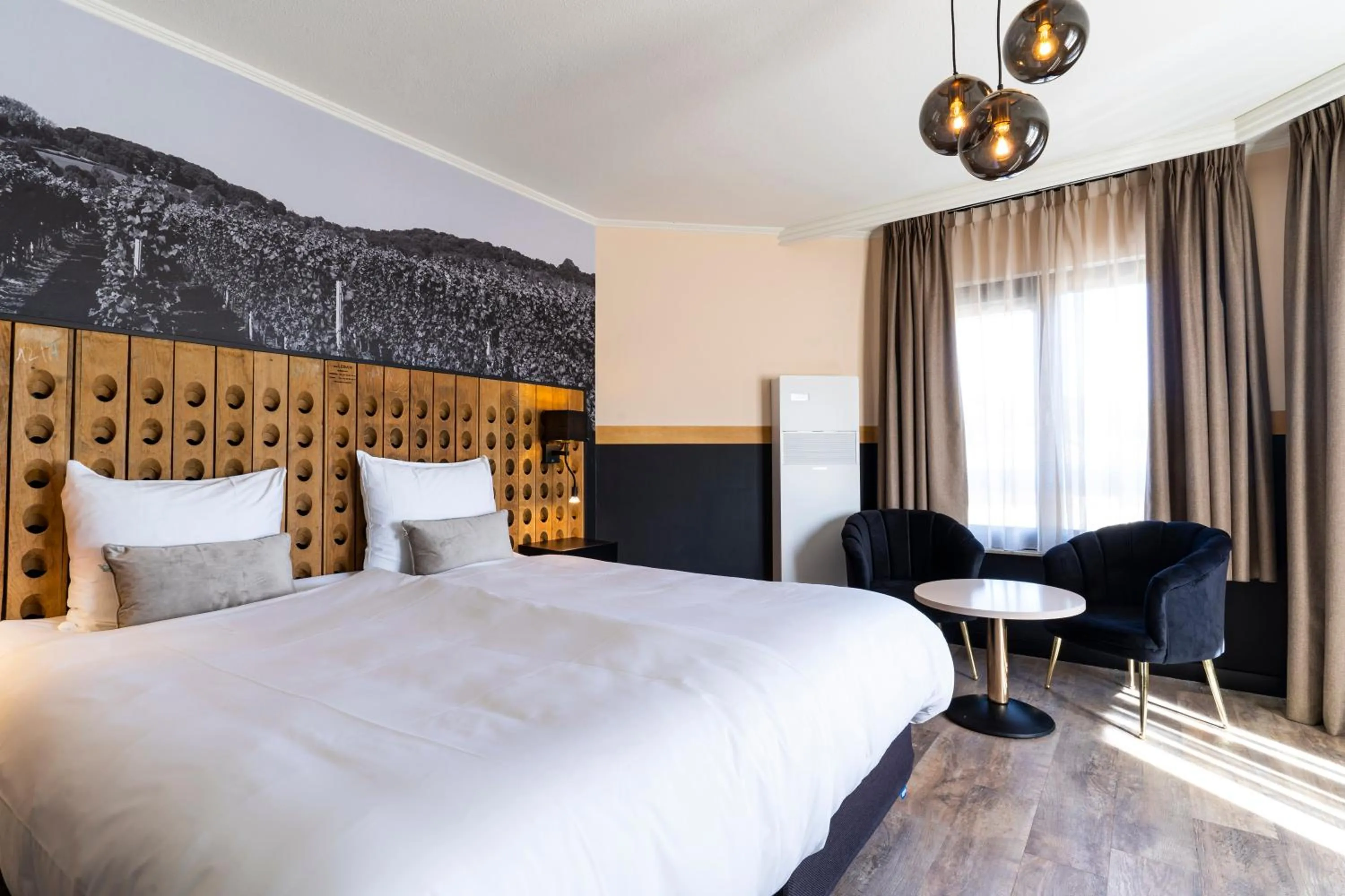 Bed in Dormio Wijnhotel Valkenburg