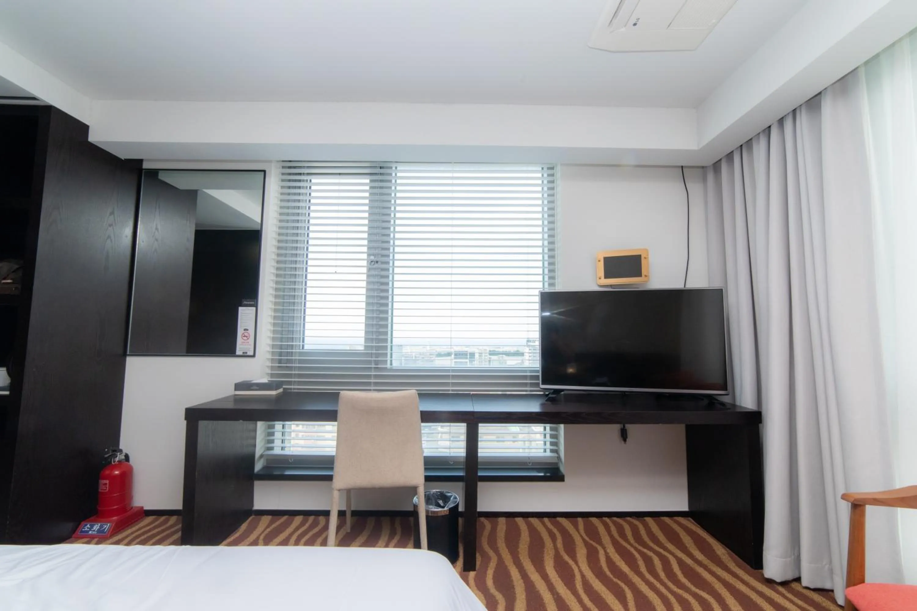 Bed in J-Grand Hotel