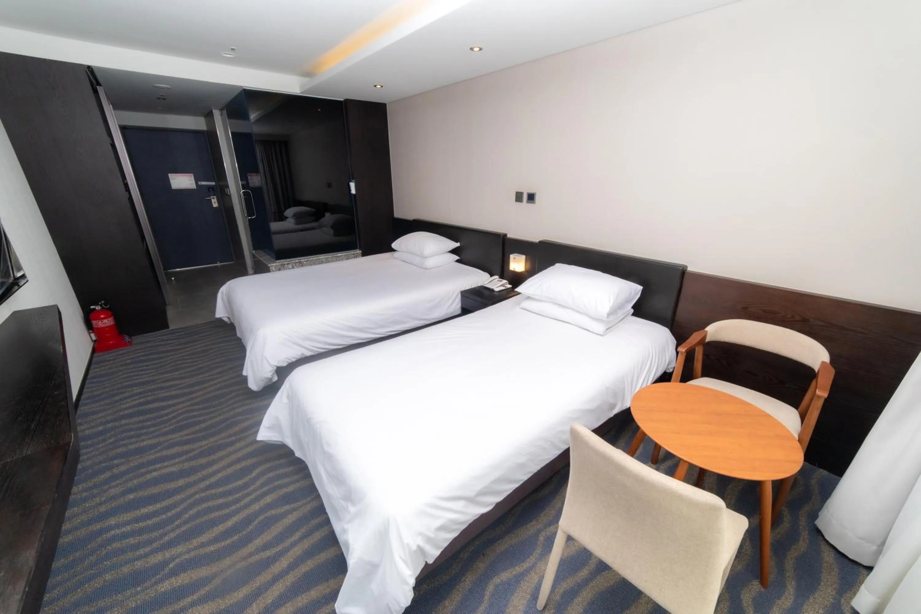 Bed in J-Grand Hotel