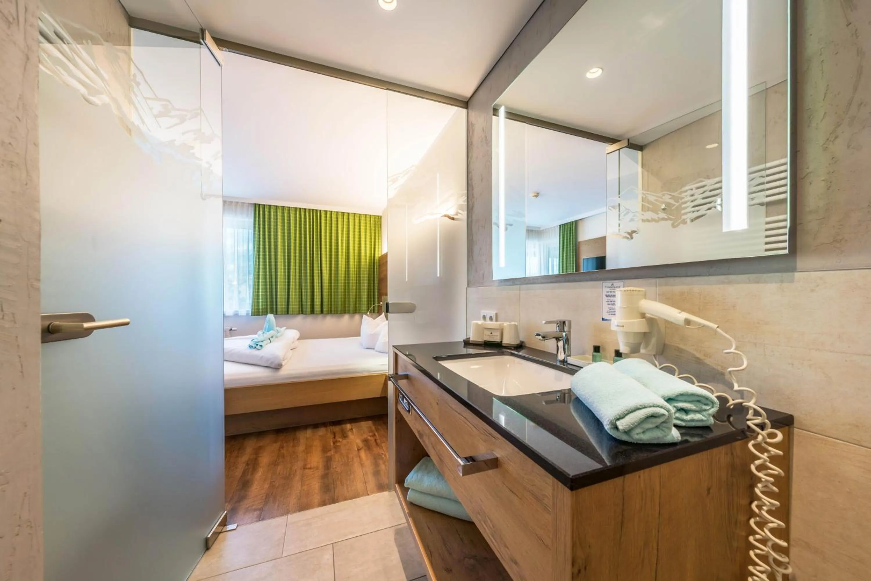 Bathroom, Bed in Aktivhotel Tuxerhof