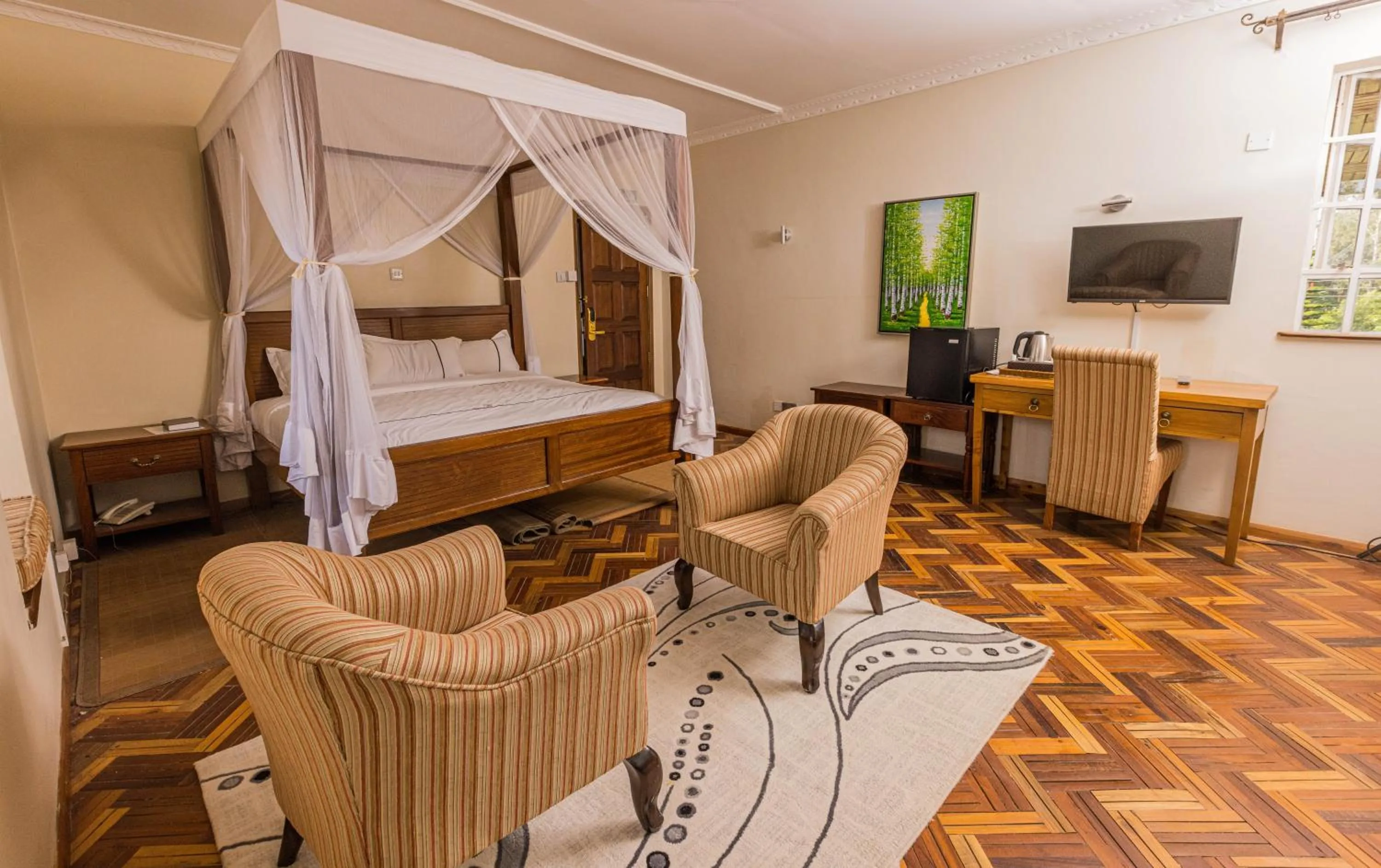 Communal lounge/ TV room in The Blixen Resort & Spa