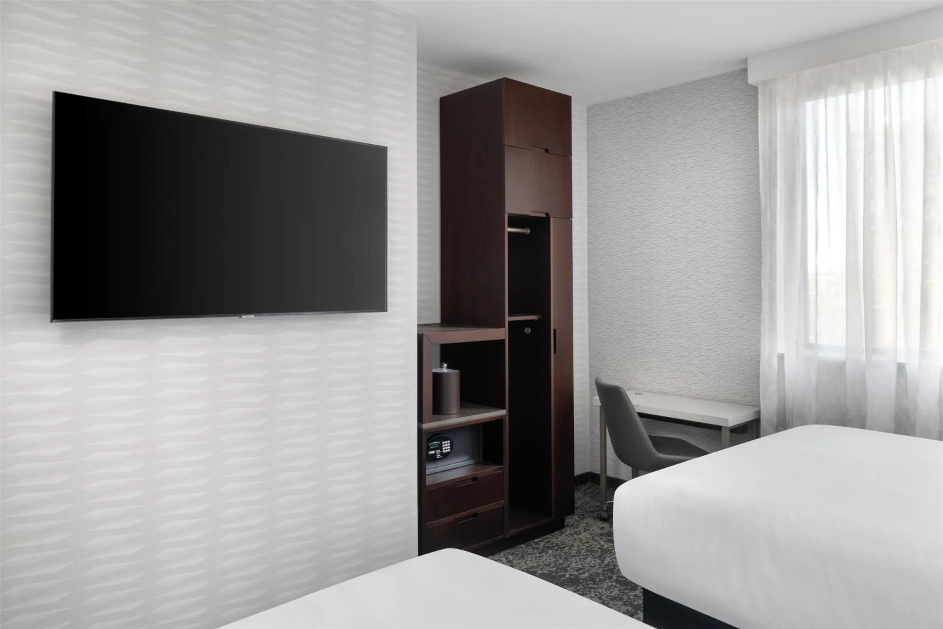 Bed in DoubleTree by Hilton Long Island City, NY