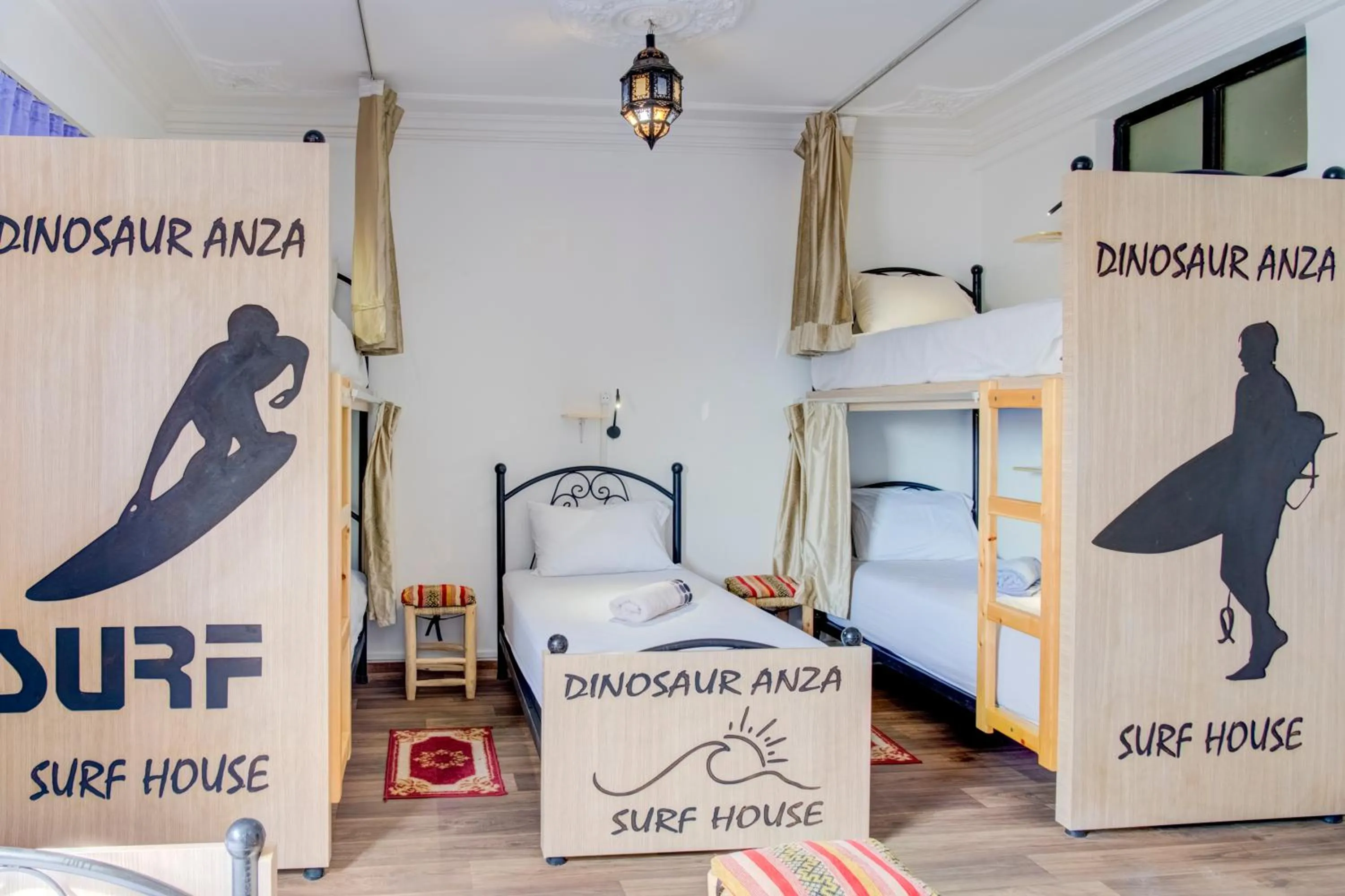 Bed in Dinosaur Anza Surf House