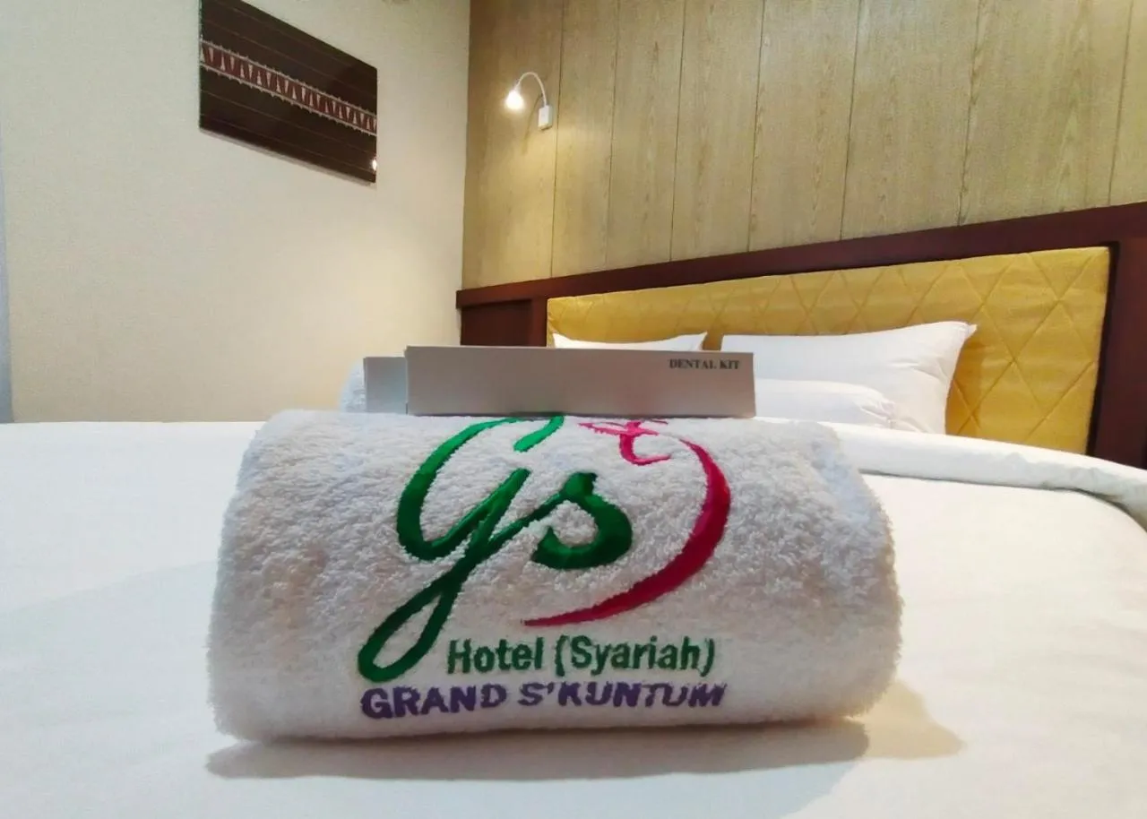 towels, Bed in Hotel Syariah GS Lampung Culture, Bandar Lampung