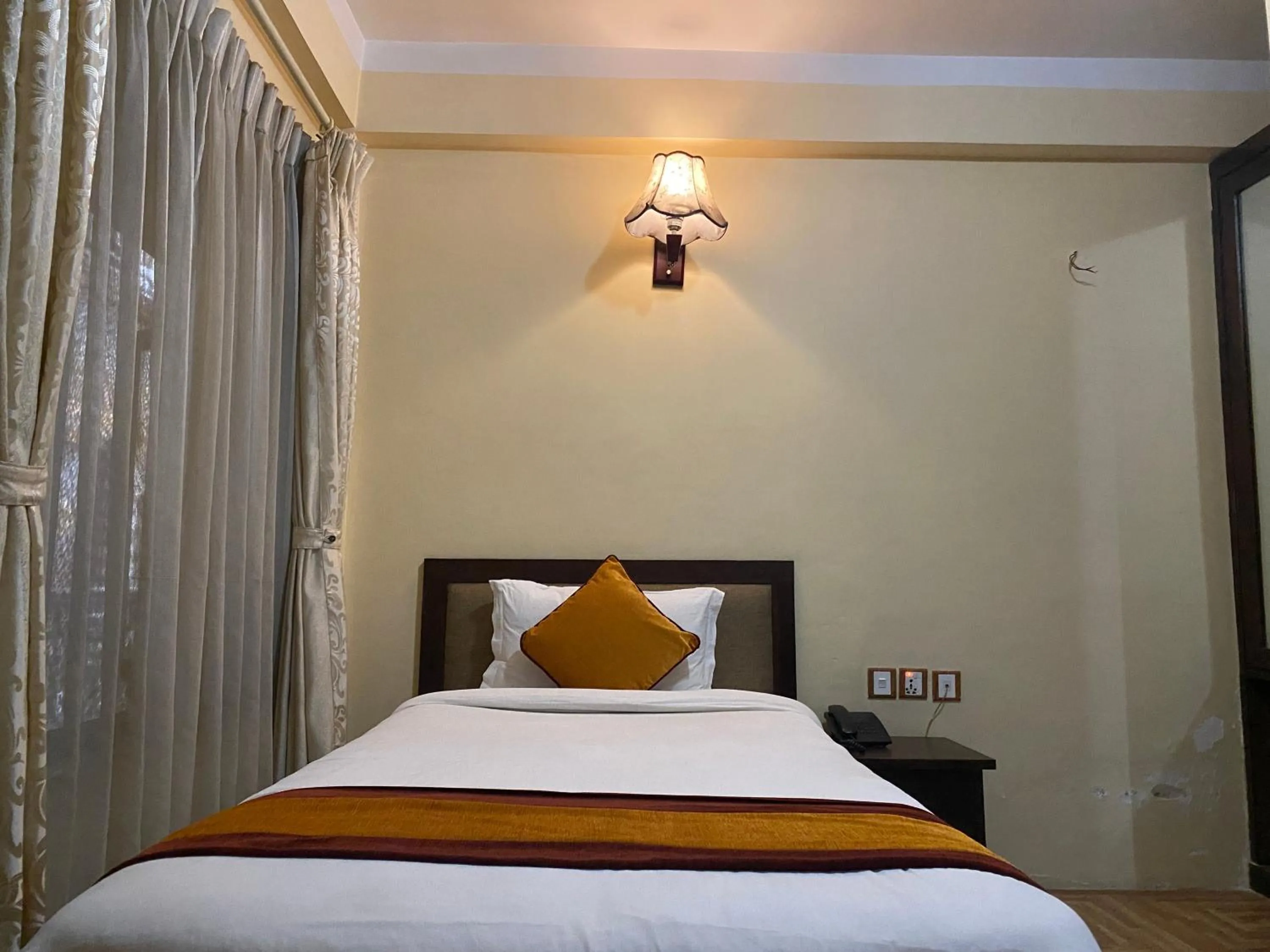 Bed in Boudha Stupa View Guest House