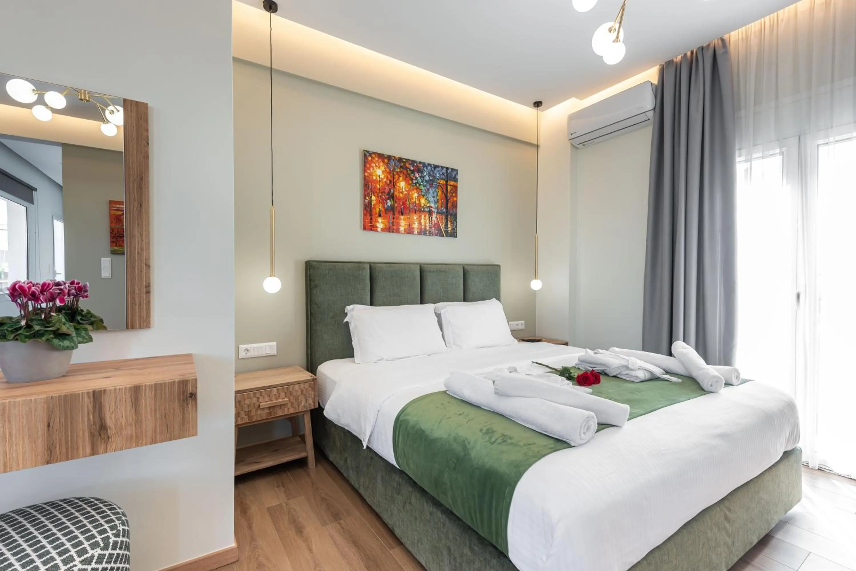 Bed in Acropolis Divine Apartments