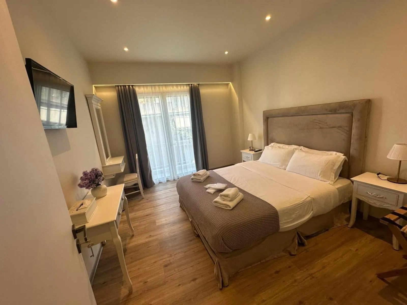 Bed in Acropolis Divine Apartments