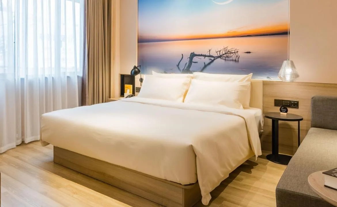 Bed in Atour Hotel Wuxi Sanyang Plaza