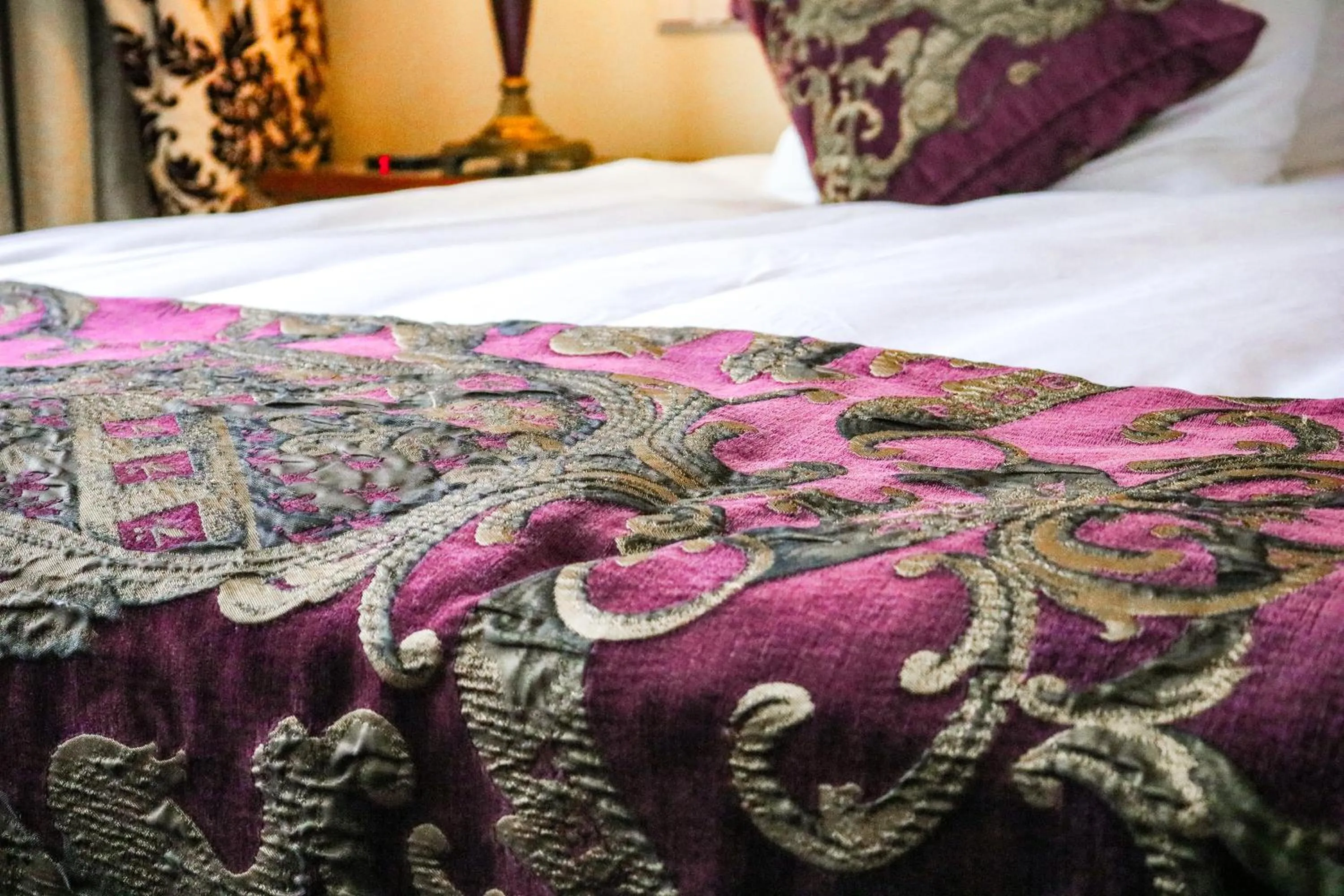 Bed in Ambassade Hotel