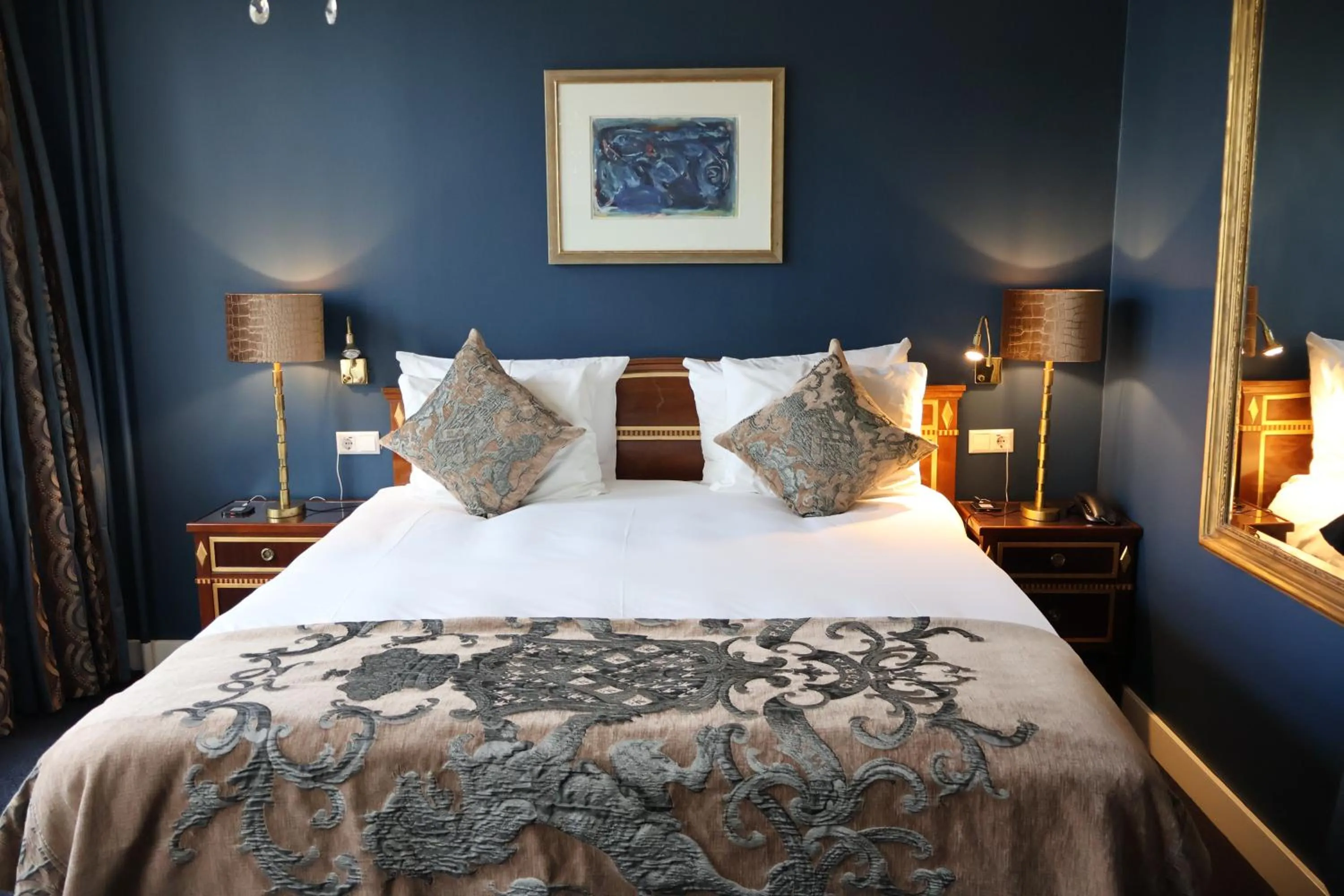 Bed in Ambassade Hotel