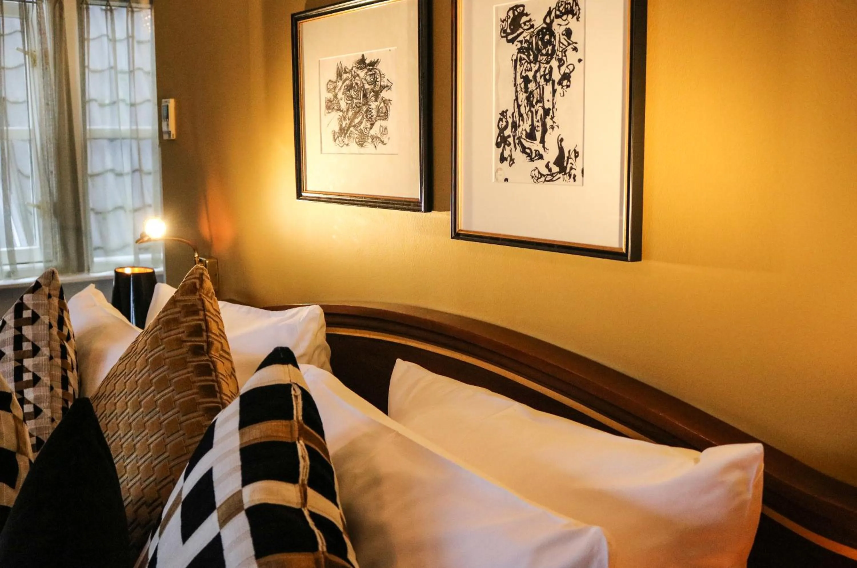 Bed in Ambassade Hotel