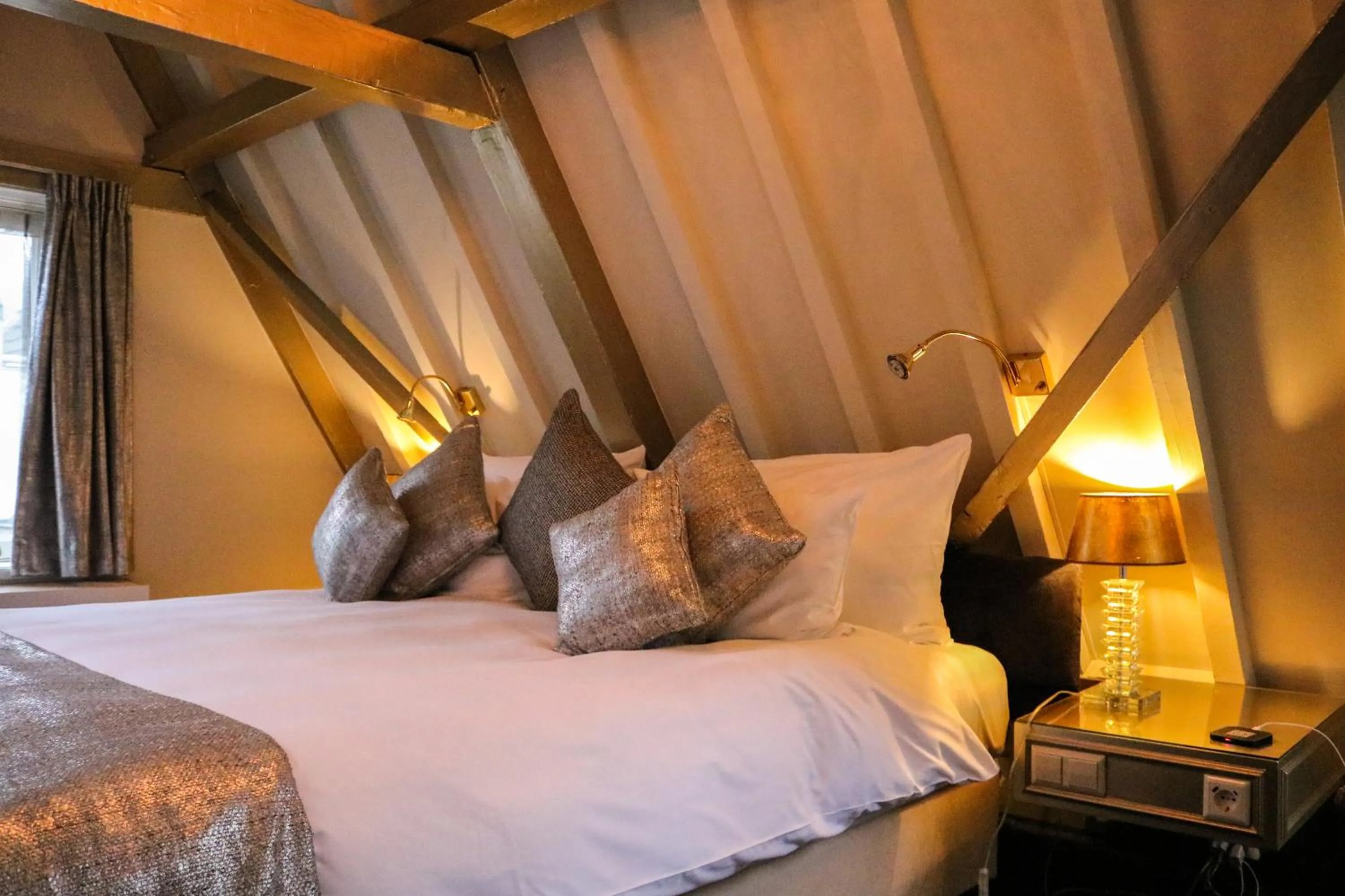 Bed in Ambassade Hotel