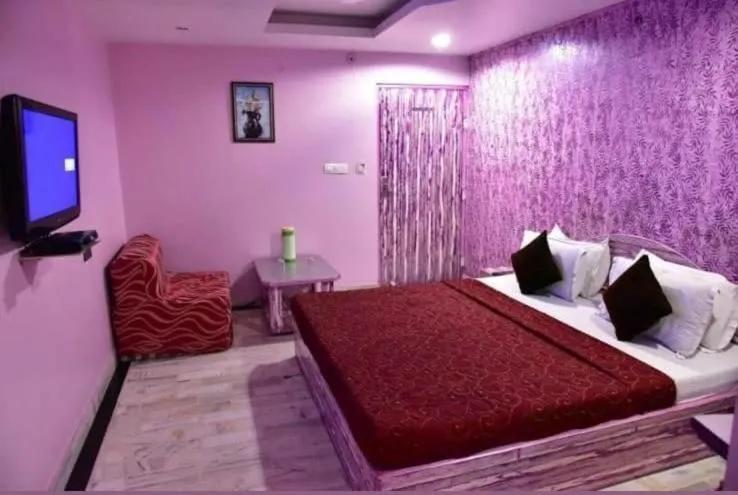 Bed in HOTEL HAYAT RESIDENCY