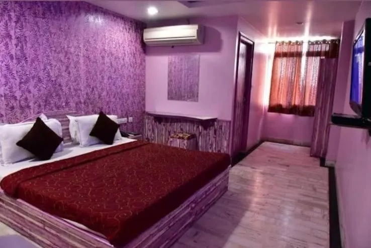 Bed in HOTEL HAYAT RESIDENCY