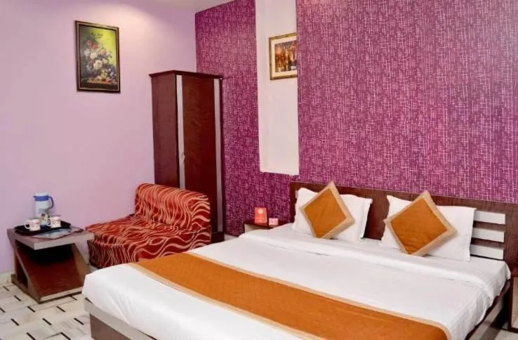 Bed in HOTEL HAYAT RESIDENCY