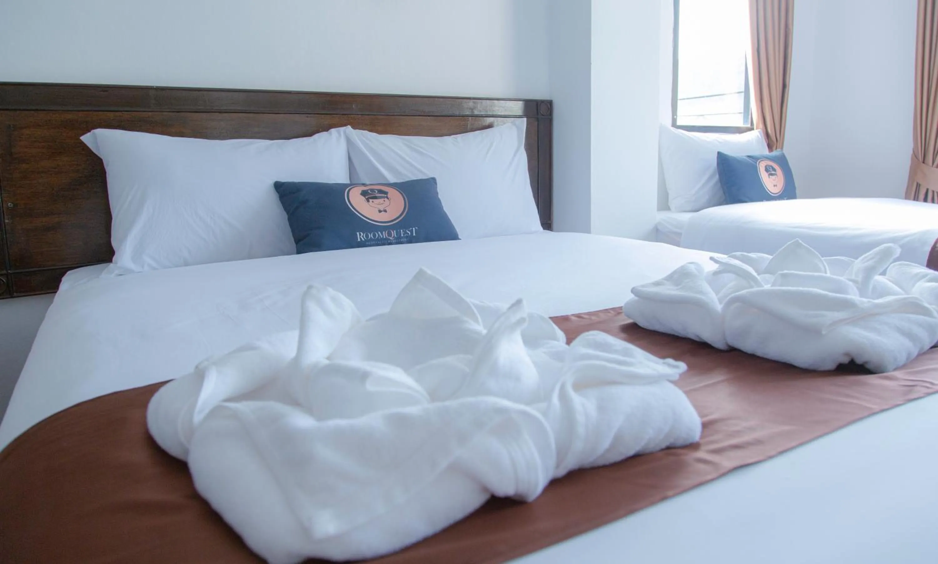 Bed in RoomQuest Kalim Beach